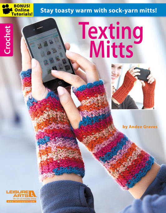 A person wears colorful, crocheted fingerless gloves made from sock yarn while using a smartphone. Inset shows a close-up of the mitts. Text: Texting Mitts—Stay Toasty Warm With Sock-Yarn Mitts! by Leisure Arts; includes patterns and tutorial.