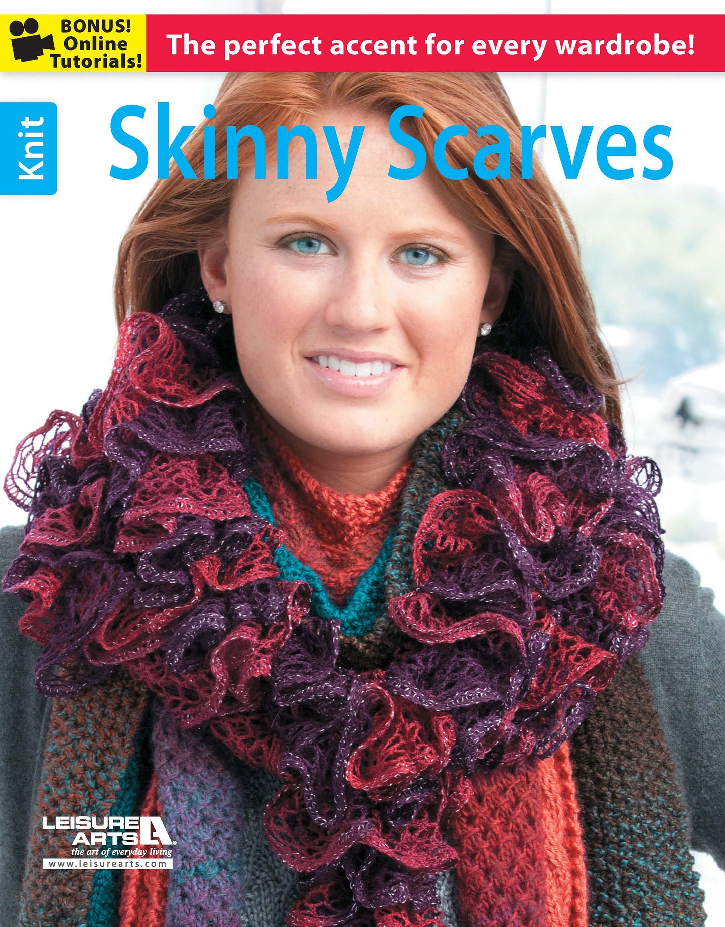 A woman with long red hair models a textured, multicolored ruffled scarf and knit sweater. The magazine cover, titled "Skinny Scarves to Knit" by Leisure Arts, highlights easy knitting patterns and bonus online tutorials on a bold red banner.