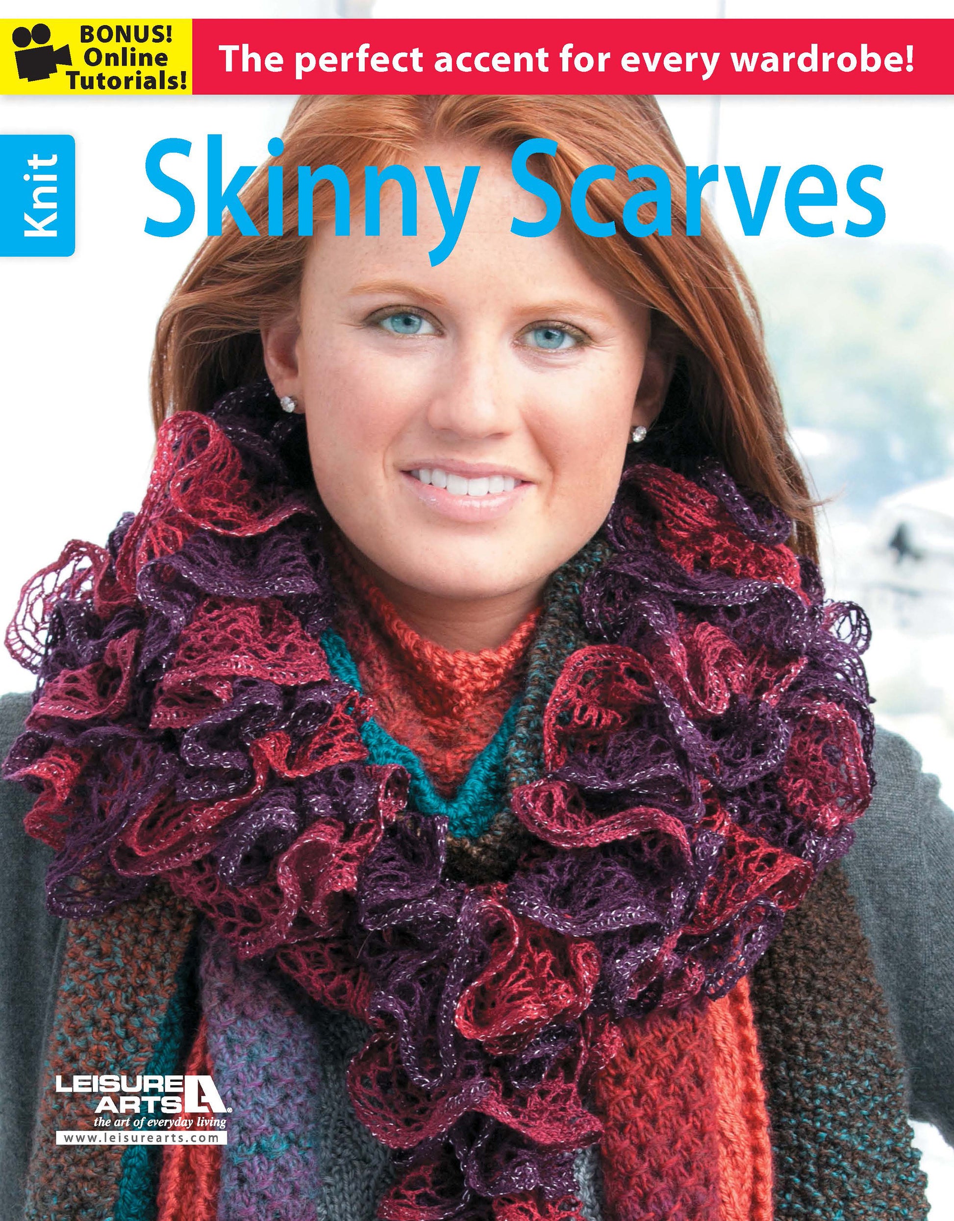 A woman with long red hair models a textured, multicolored ruffled scarf and knit sweater. The magazine cover, titled "Skinny Scarves to Knit" by Leisure Arts, highlights easy knitting patterns and bonus online tutorials on a bold red banner.