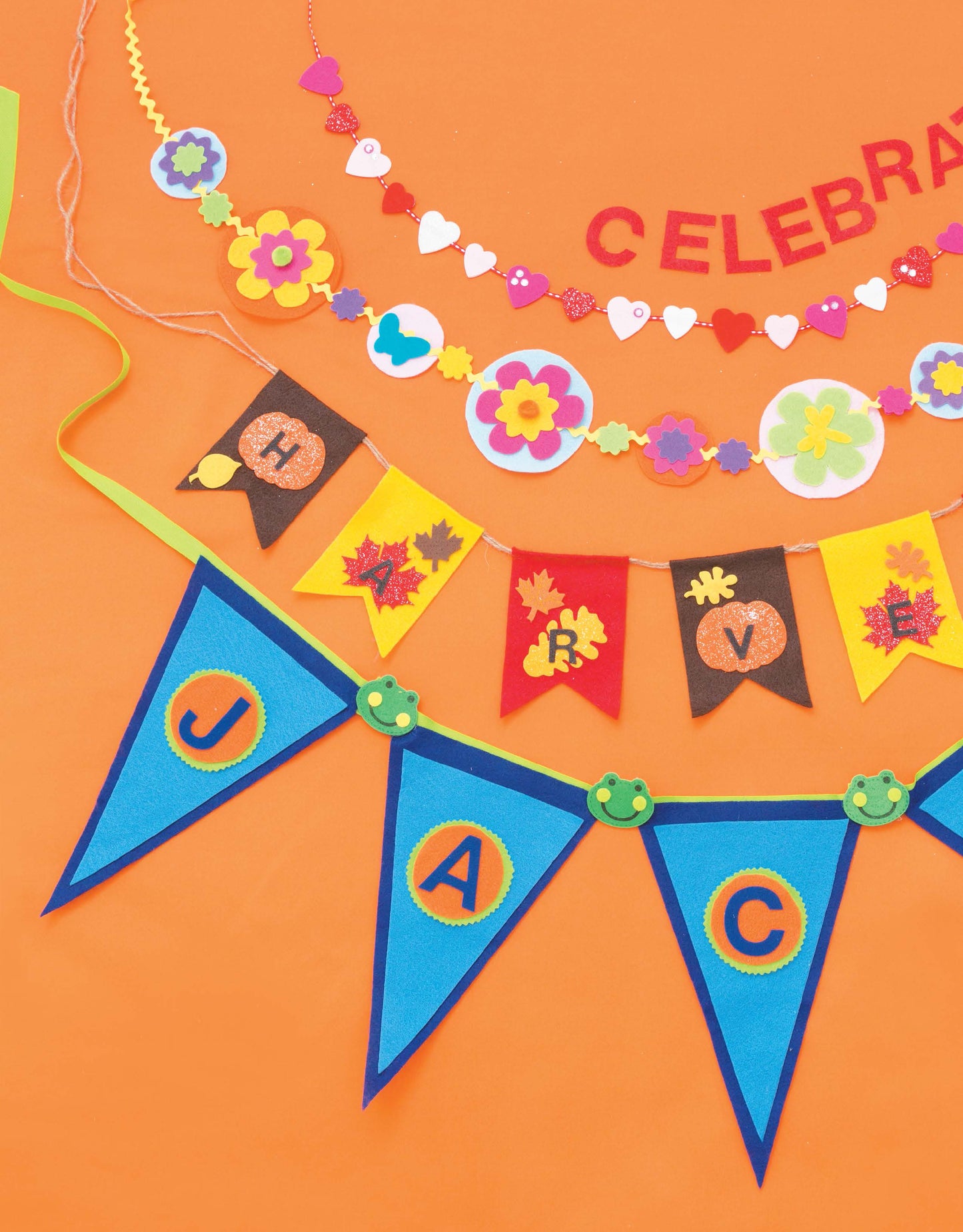 Bright, handmade banners from "Crafting with Felt" by Leisure Arts—featuring floral and heart garlands, autumn flags with H and V letters, plus blue pennants spelling JAC—add charming color to any home decor.