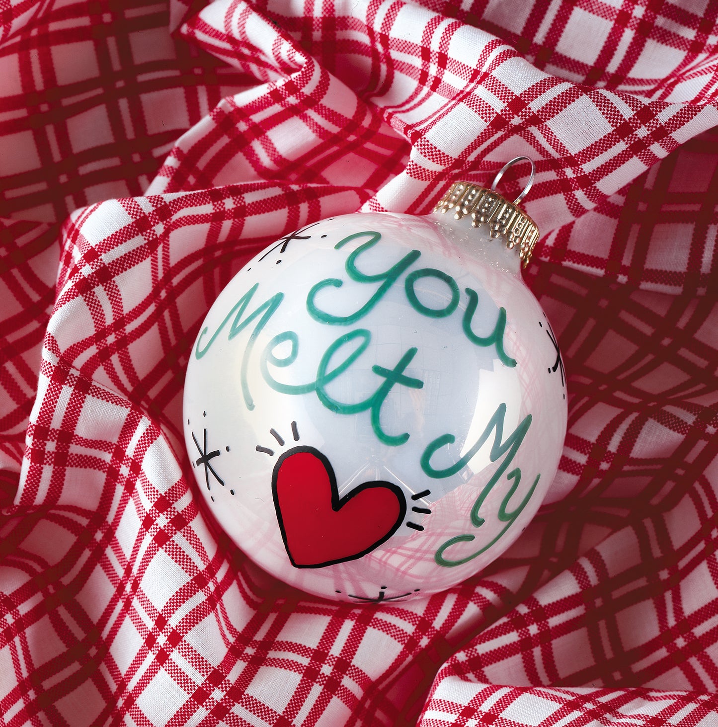 The Leisure Arts Holiday Ornaments Digital Download features a white ornament with "You Melt My" in green script and a red heart on plaid fabric—perfect inspiration for unique holiday ornament crafts.