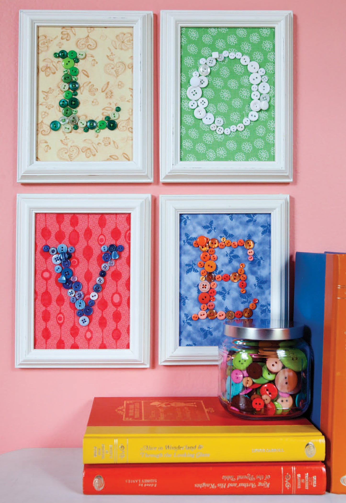 Add charming flair to your home with "Crafting with Buttons and Ribbons" by Leisure Arts—featuring colorful button letters on patterned backgrounds, perfect above stacked books or as inspiration for needlework and paper craft lovers.