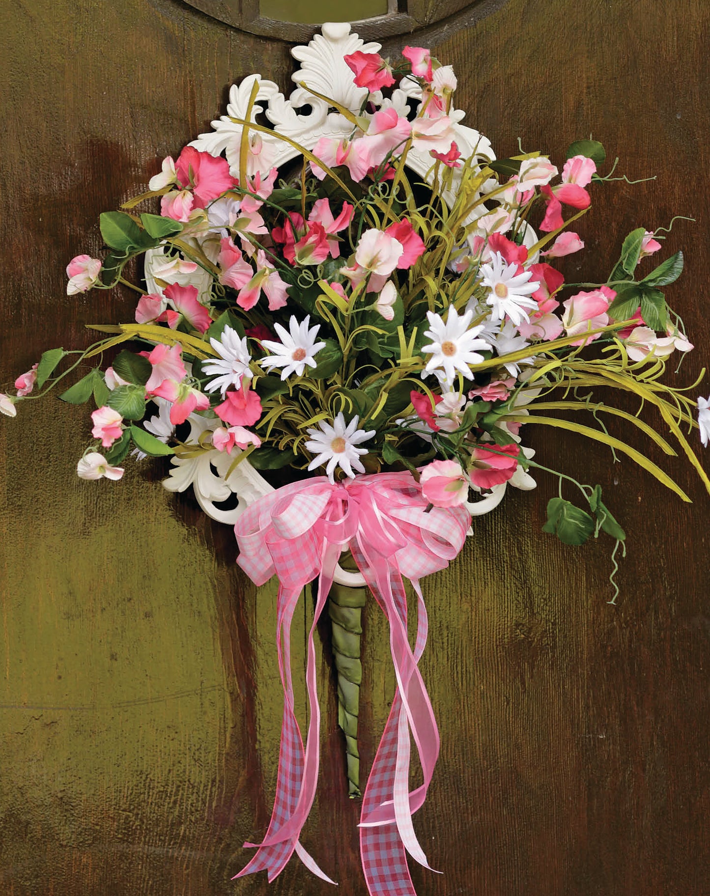 Crafting with Florals by Leisure Arts features a bouquet of pink and white flowers with greenery, tied with a pink gingham bow—ideal for DIY arrangements or charming home decor.