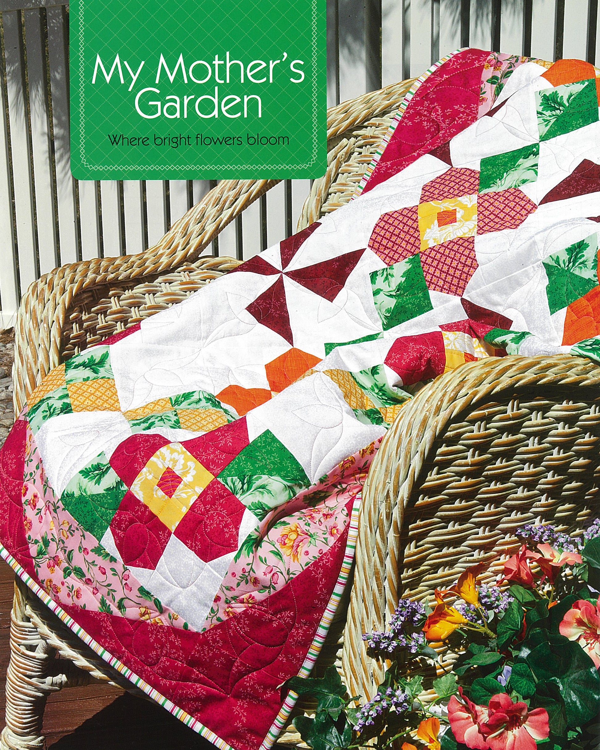 A cheerful patchwork quilt from Simple Patchwork Quilts—Best of Quiltmaker by Leisure Arts, with floral and geometric patterns, drapes over a wicker chair. Nearby, bright flowers bloom. The text reads: My Mother’s Garden.