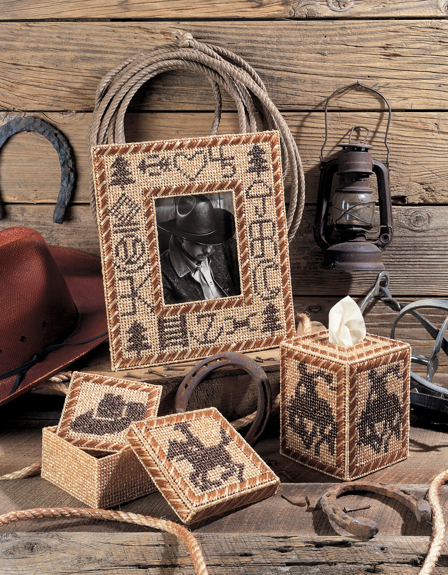 Bring home the Wild West with "Out West—Rustic Designs for the Cowboy in Your Life!" by Leisure Arts—a digital download featuring cowboy hats, rope, horseshoes, lanterns, and plastic canvas crafts with cowboy and rodeo motifs.