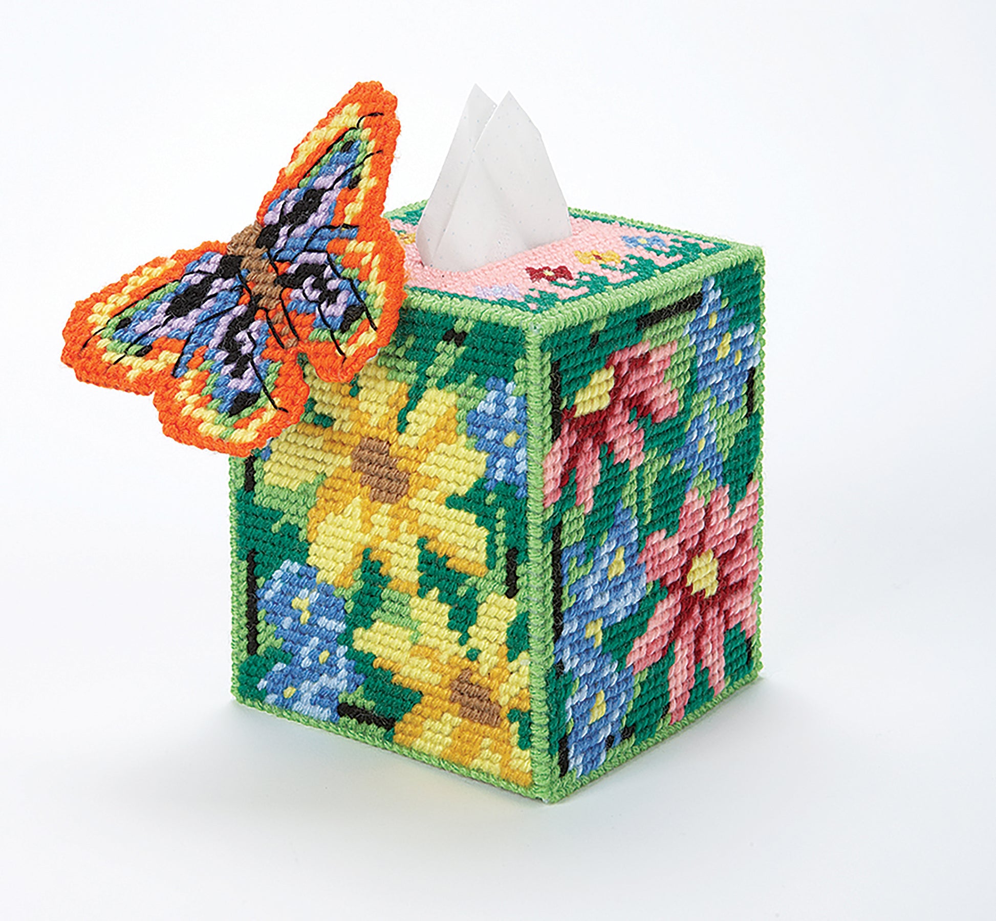 Leisure Arts' "Tissue Box Covers—8 Projects to Brighten Up Any Room in Your Home" features decorative needlepoint designs, including vibrant floral and butterfly patterns crafted with worsted weight yarn and plastic canvas. Perfect for adding a cheerful touch!.