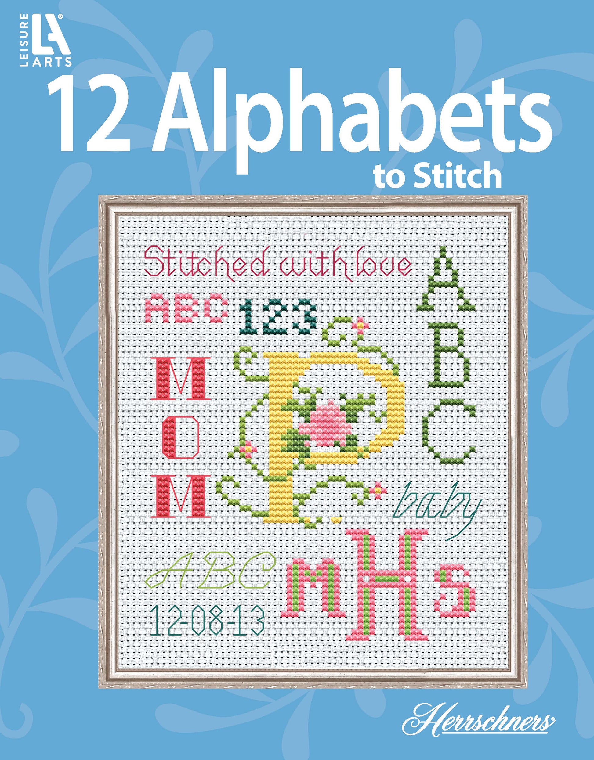 Leisure Arts’ 12 Alphabets to Stitch is a cross-stitch sampler with colorful alphabets, numbers, “MOM,” and floral designs on a blue background, titled “12 Alphabets to Stitch” at the top.