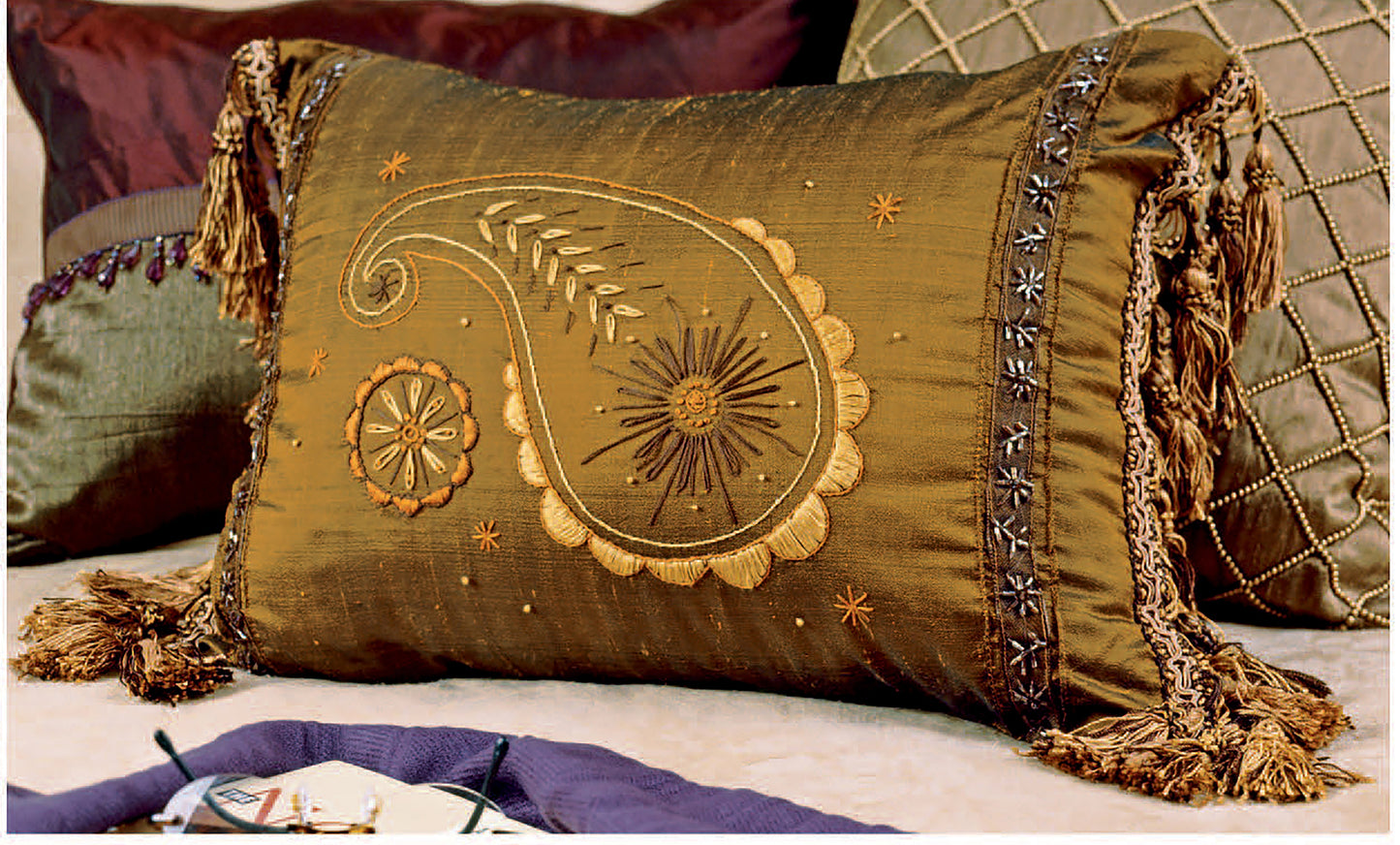 The Learn to Embroider with the Best of Leisure Arts book by Leisure Arts offers decorative embroidery ideas, like paisley and floral designs with gold details—perfect for jacket embellishments or beginner sewing projects.