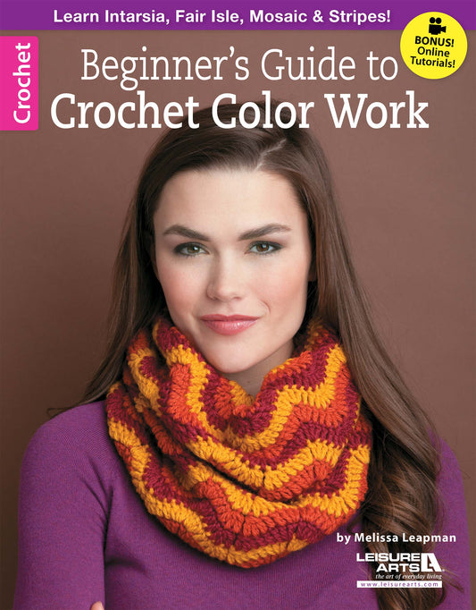 A woman in a purple top and chunky, colorful crochet cowl appears on the cover of Beginner's Guide to Crochet Color Work from Leisure Arts, highlighting creative mosaic crochet projects.