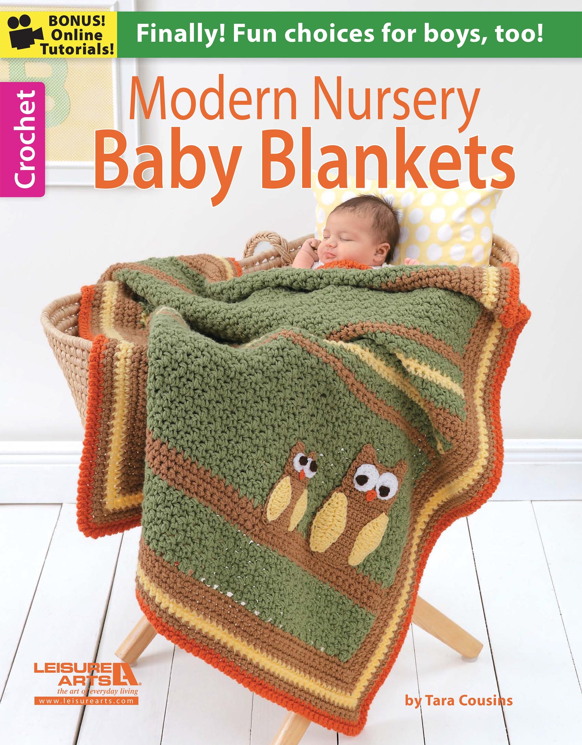 A baby naps on a patterned pillow under an owl-themed crocheted blanket in green, orange, and brown. This image is the cover of “Modern Nursery Baby Blankets Digital Download” by Leisure Arts, featuring easy crochet patterns for kids.