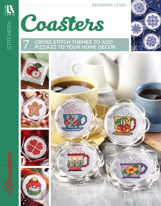 Coasters—7 Cross Stitch Themes to Add Pizzazz to Your Home Decor by Leisure Arts features beginner-friendly patterns like mugs, fruit, and gingerbread, plus photos of vibrant finished coasters with drinks and desserts.