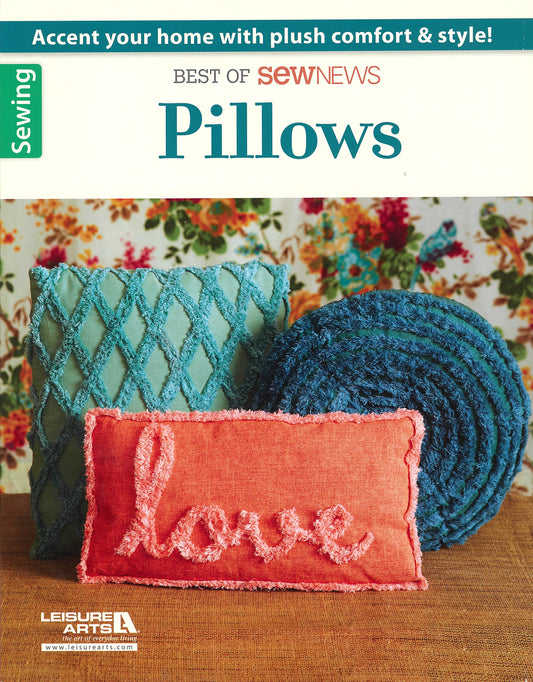 Three accent pillows from Leisure Arts—teal diamond-quilted square, teal round ruffled, and coral "love"—add plush comfort and style to your home, displayed against a floral-patterned background.