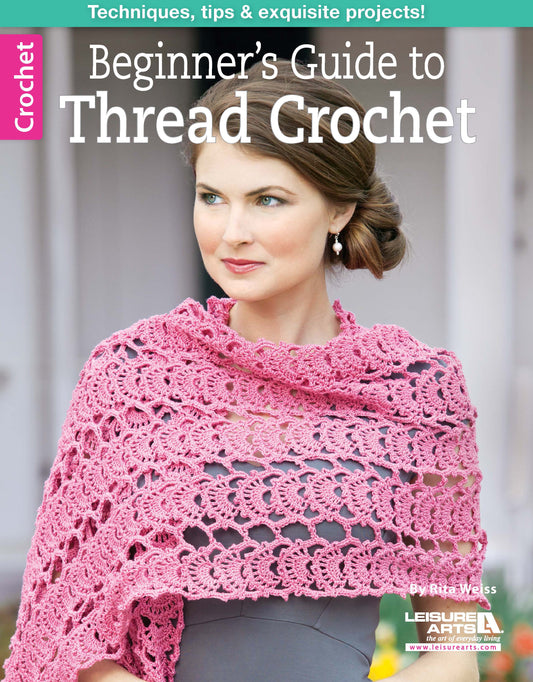 A woman in a light gray dress and pink crocheted shawl stands before an arched doorway. The cover reads, Beginner's Guide to Thread Crochet by Leisure Arts—perfect for learning crochet techniques and beginner projects.