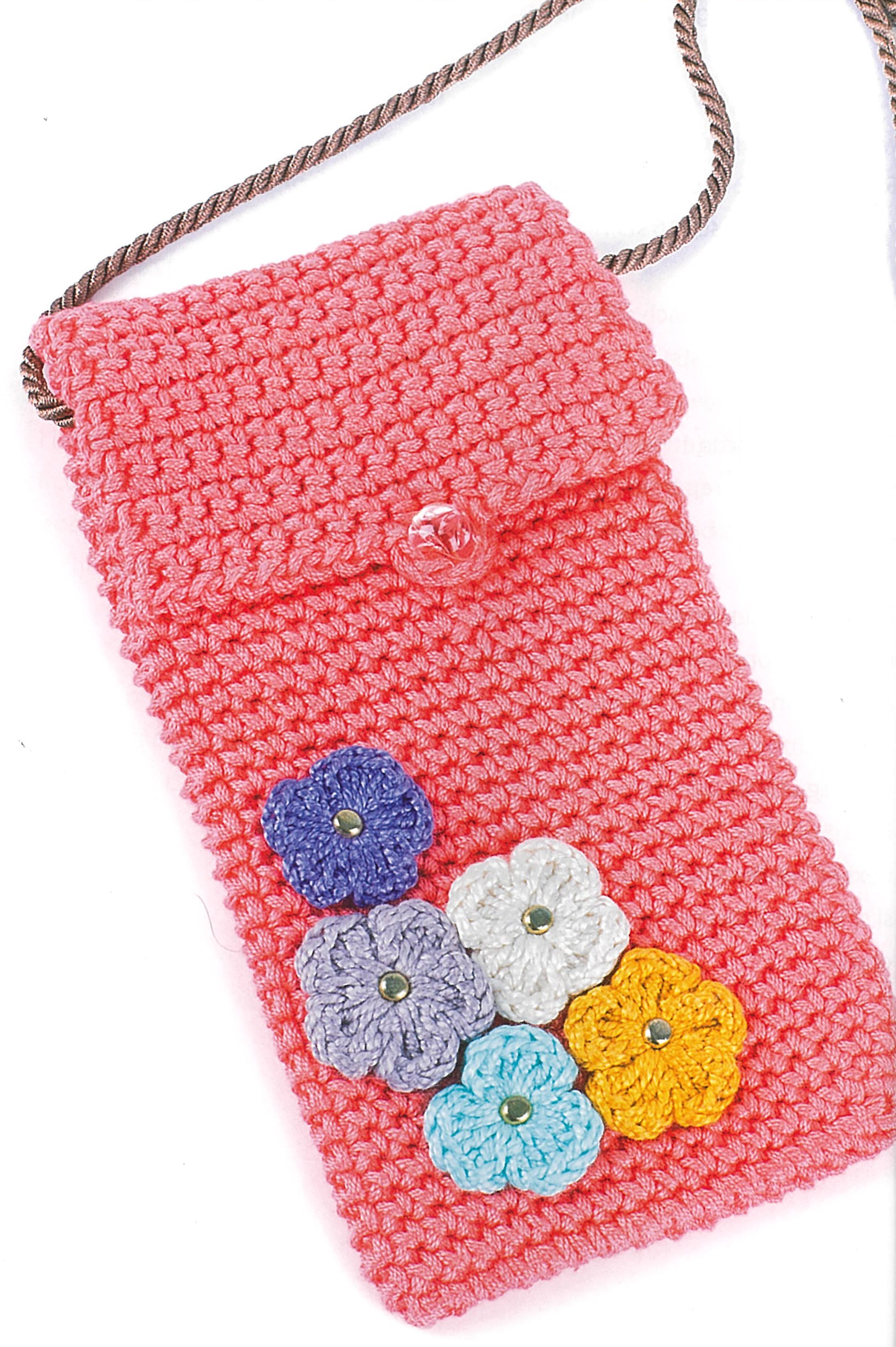 The Learn to Crochet kit by Leisure Arts lets you make a pink crocheted pouch with a shoulder strap, decorated with five flower appliqués in purple, white, blue, yellow, and lavender—great for kids’ or teens’ crochet projects.