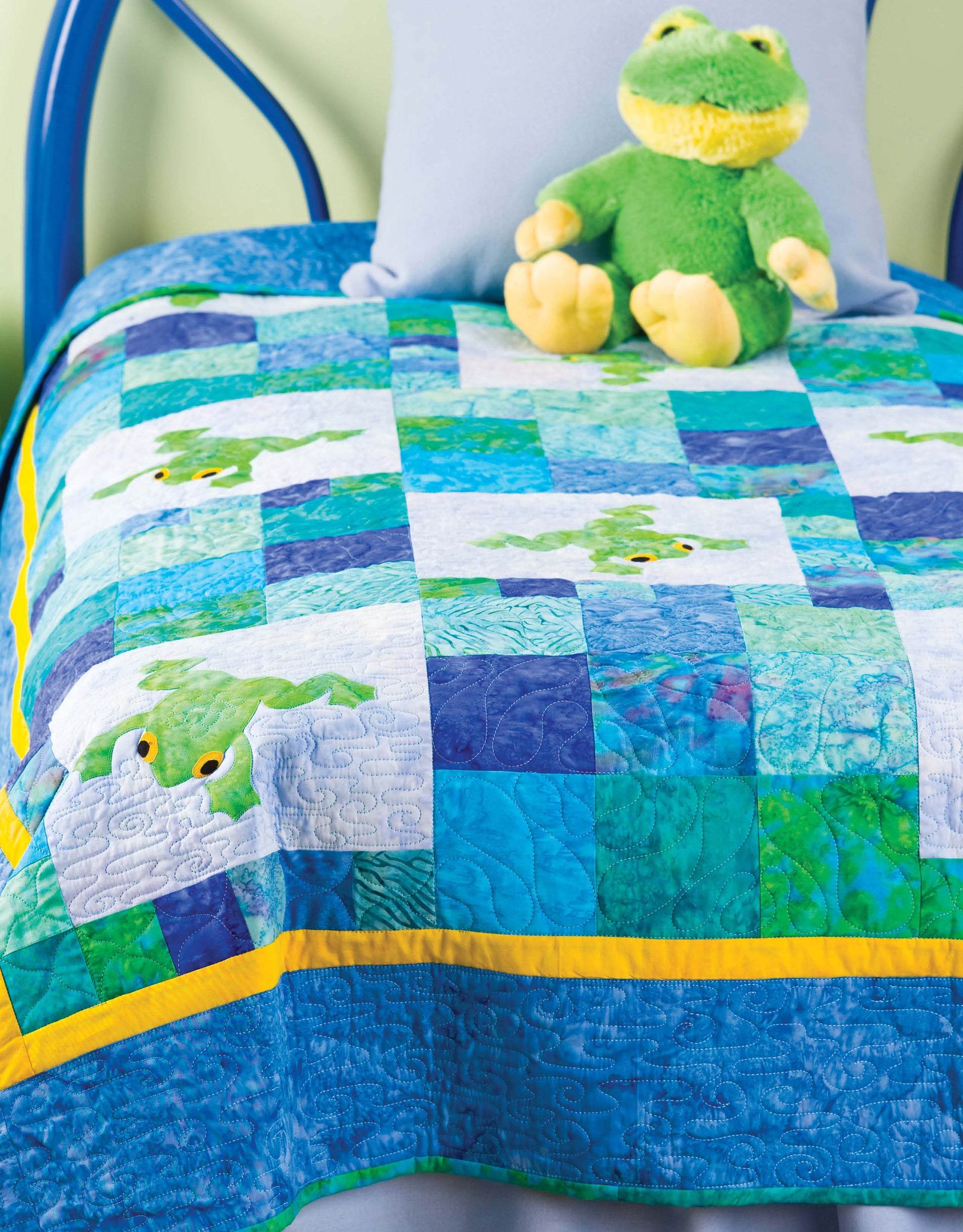 The "Baby Bright Quilts—Use Pops of Color in Stunning Baby Designs!" book by Leisure Arts showcases colorful patchwork quilts with playful frog motifs—perfect for beginners seeking fun and creative baby quilt inspiration.
