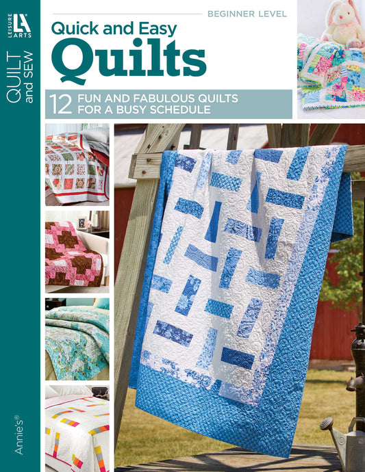 Cover of the quilting book "Quick & Easy Quilts" by Leisure Arts. Main image features a blue and white quilt on a fence; smaller quilts appear on the left. Text promotes beginner patterns and 12 inspiring quilt projects to make.