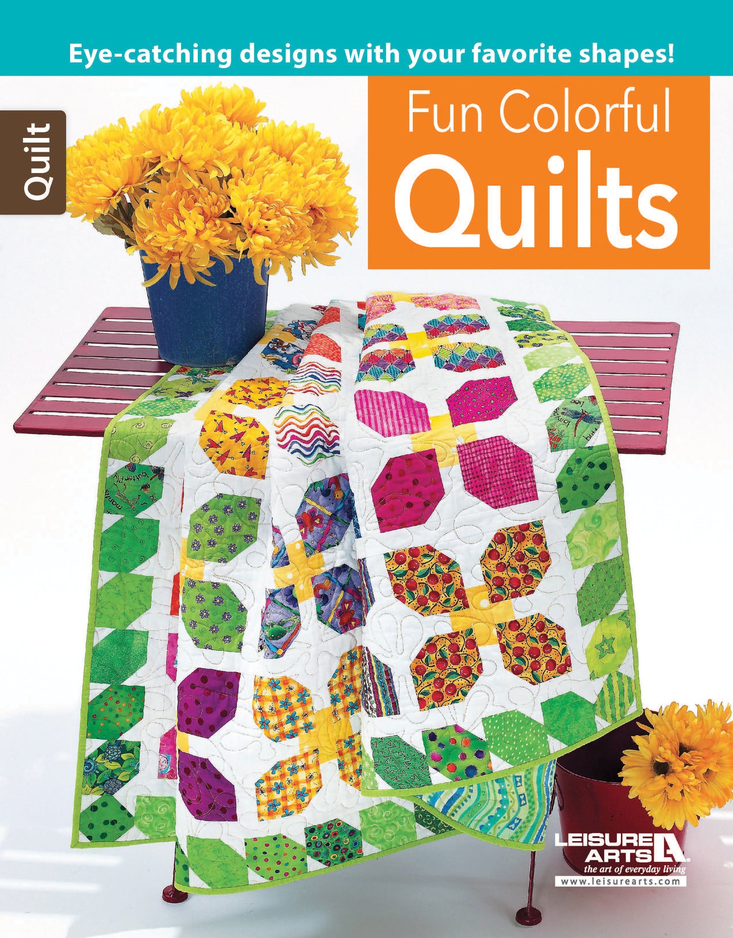A vibrant quilt with butterfly patterns lies on a red bench near a yellow potted flower. Featured is Leisure Arts' "Fun Colorful Quilts Digital Download," offering striking quilting designs and step-by-step instructions.