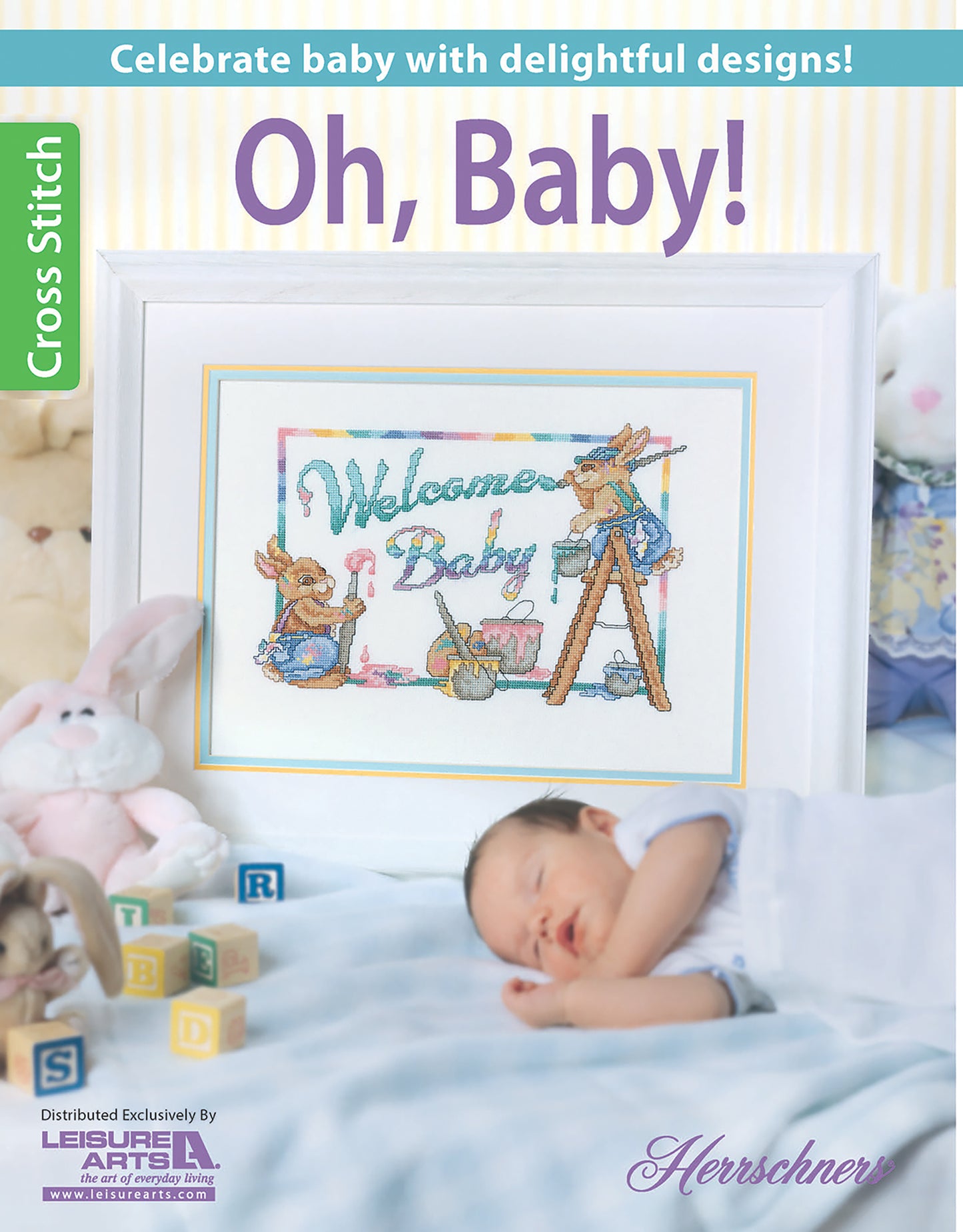 A sleeping baby is surrounded by soft toys and a blanket, in front of a framed cross stitch design with rabbits, pastels, and “Welcome Baby.” The text reads: Oh, Baby! Digital Download by Leisure Arts.