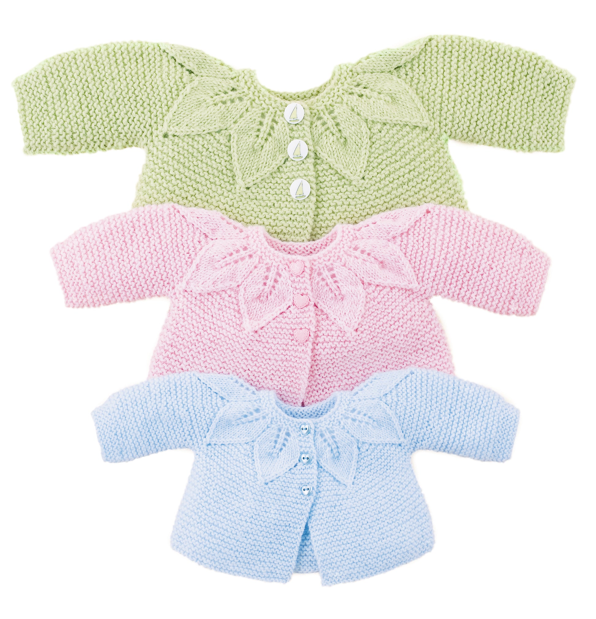 Three baby cardigans from Leisure Arts' Lace & Leaves for Baby are stacked—green, pink, and blue—each with a leaf yoke design, making them perfect for your baby layette knitting pattern collection.