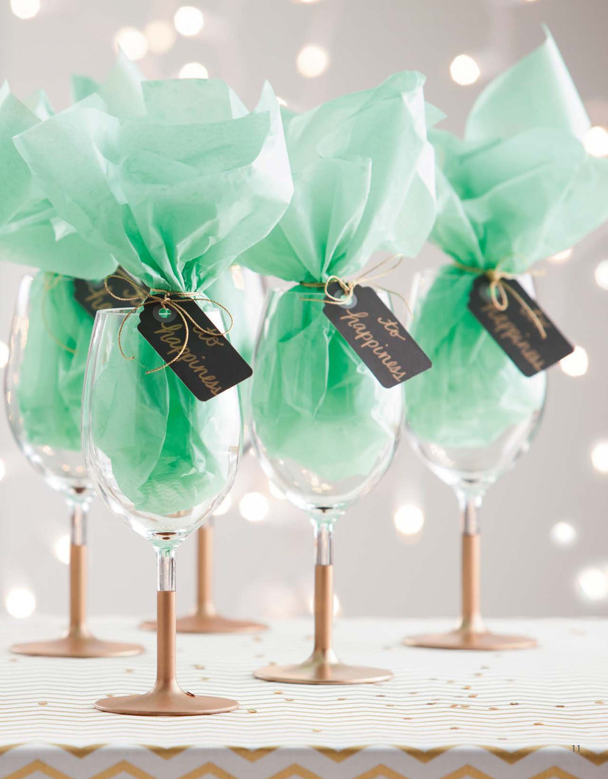 Add a festive touch to your celebration with Glam Wedding Favors Digital Download by Leisure Arts—featuring wine glasses with gold stems, mint green tissue paper, and “for happiness” gift tags—perfect as DIY or wedding favors.