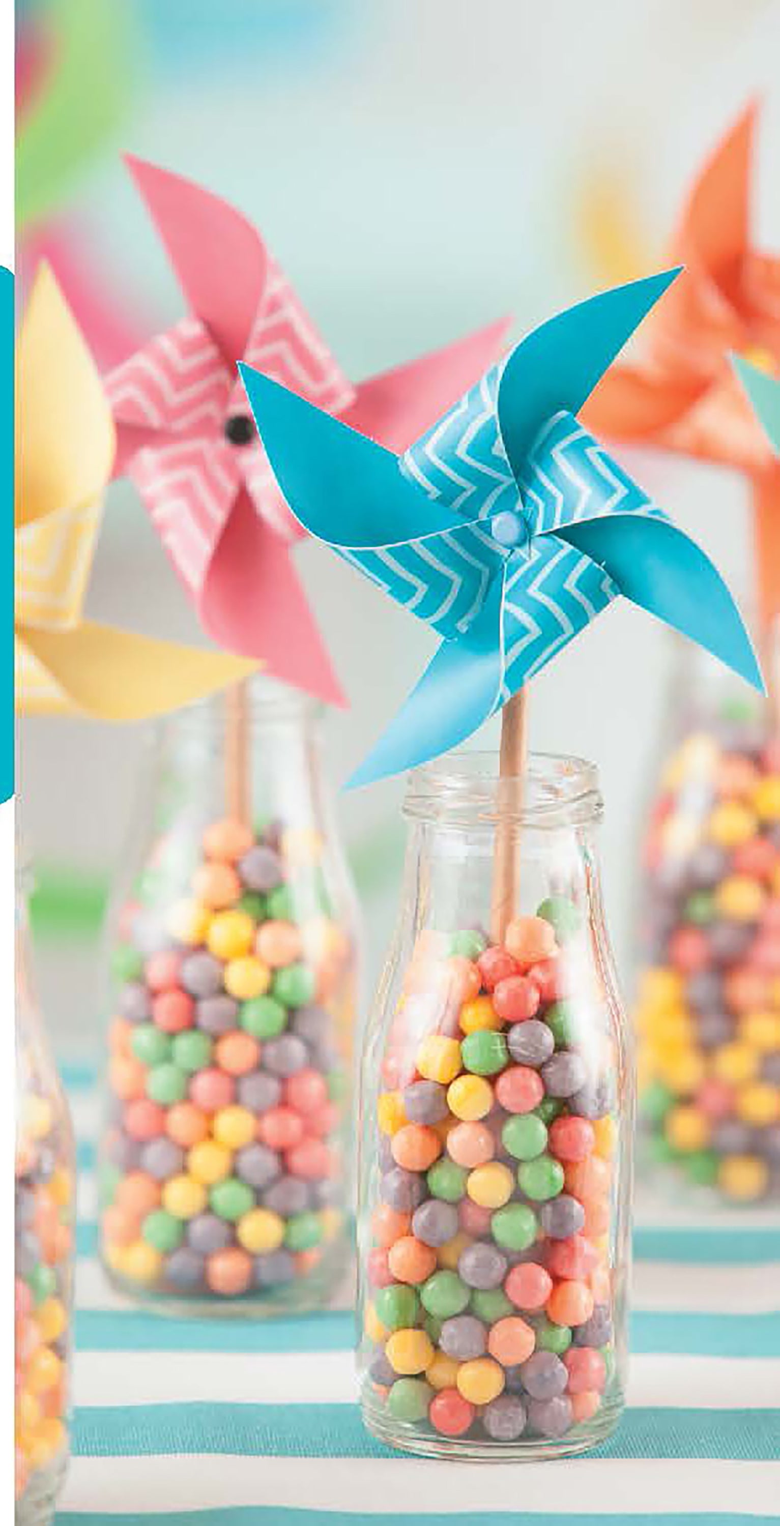 Celebrate Birthdays by Leisure Arts offers unique DIY party crafts—colorful pinwheels on wooden sticks in glass bottles with multicolored candies—ideal as playful decorations for themed parties for kids or adults.