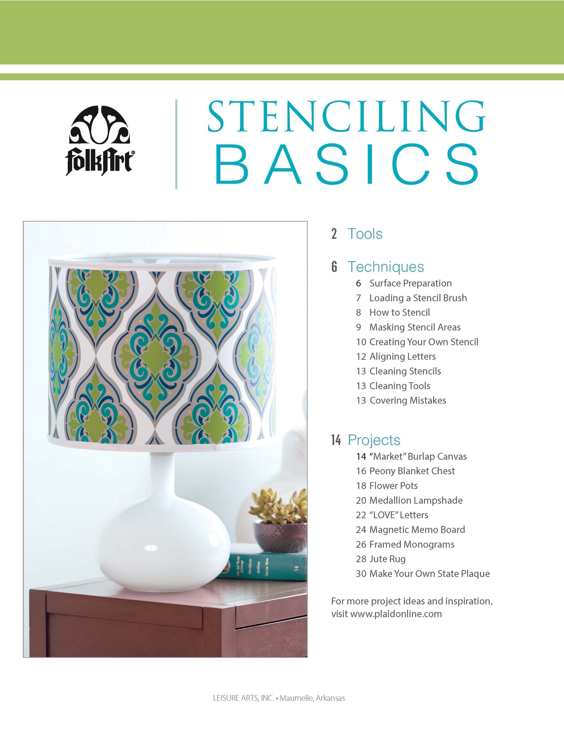 The Stenciling Basics Digital Download by Leisure Arts is shown next to a decorative table lamp with a white base and a shade featuring blue, green, and gold patterns, highlighting creative home decor projects, techniques, and tips.