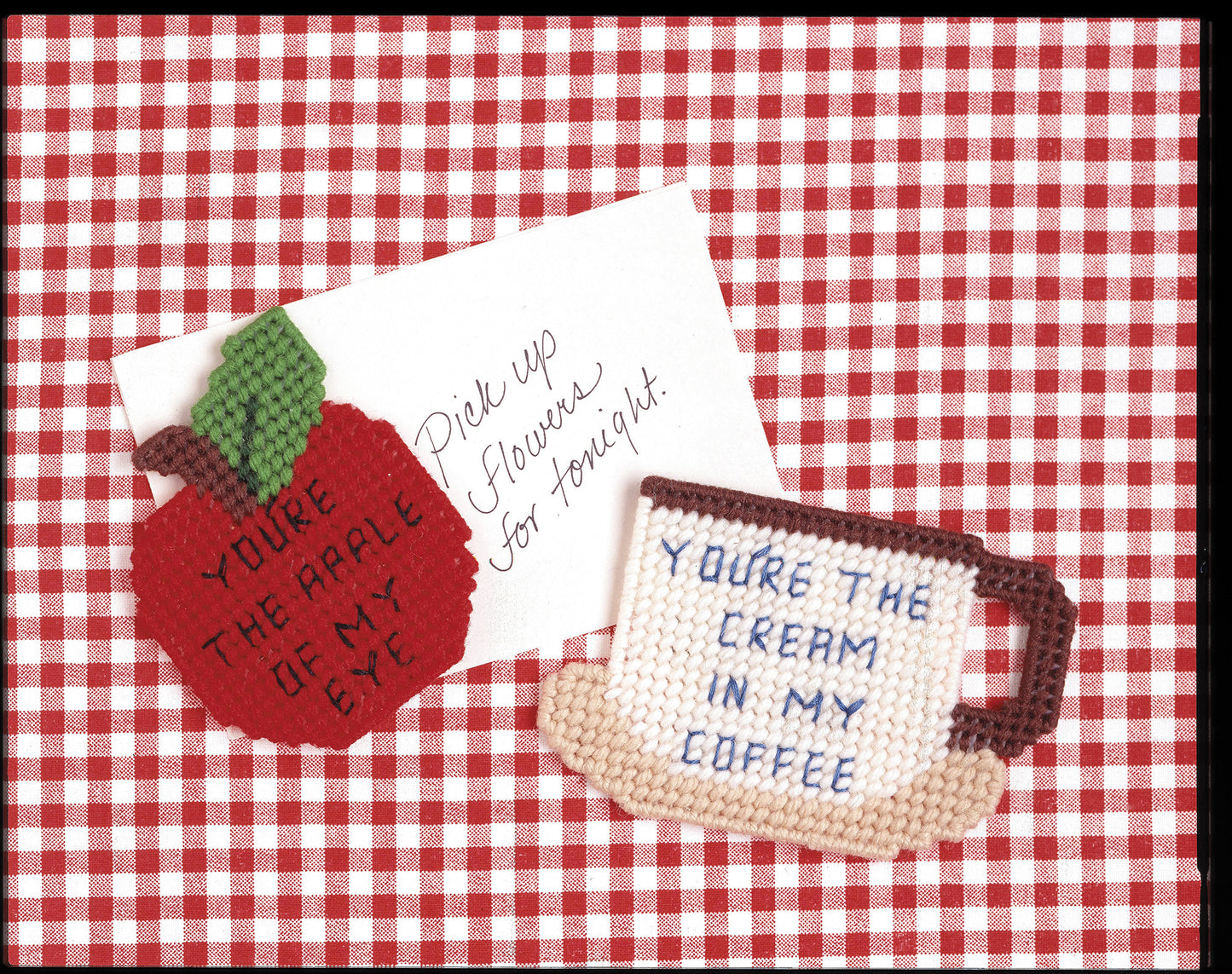 Create charming needlepoint magnets with Gifts Galore in Plastic Canvas Digital Download by Leisure Arts—includes patterns for a red gingham apple ("You’re the apple of my eye") and coffee mug ("You’re the cream in my coffee") designs.