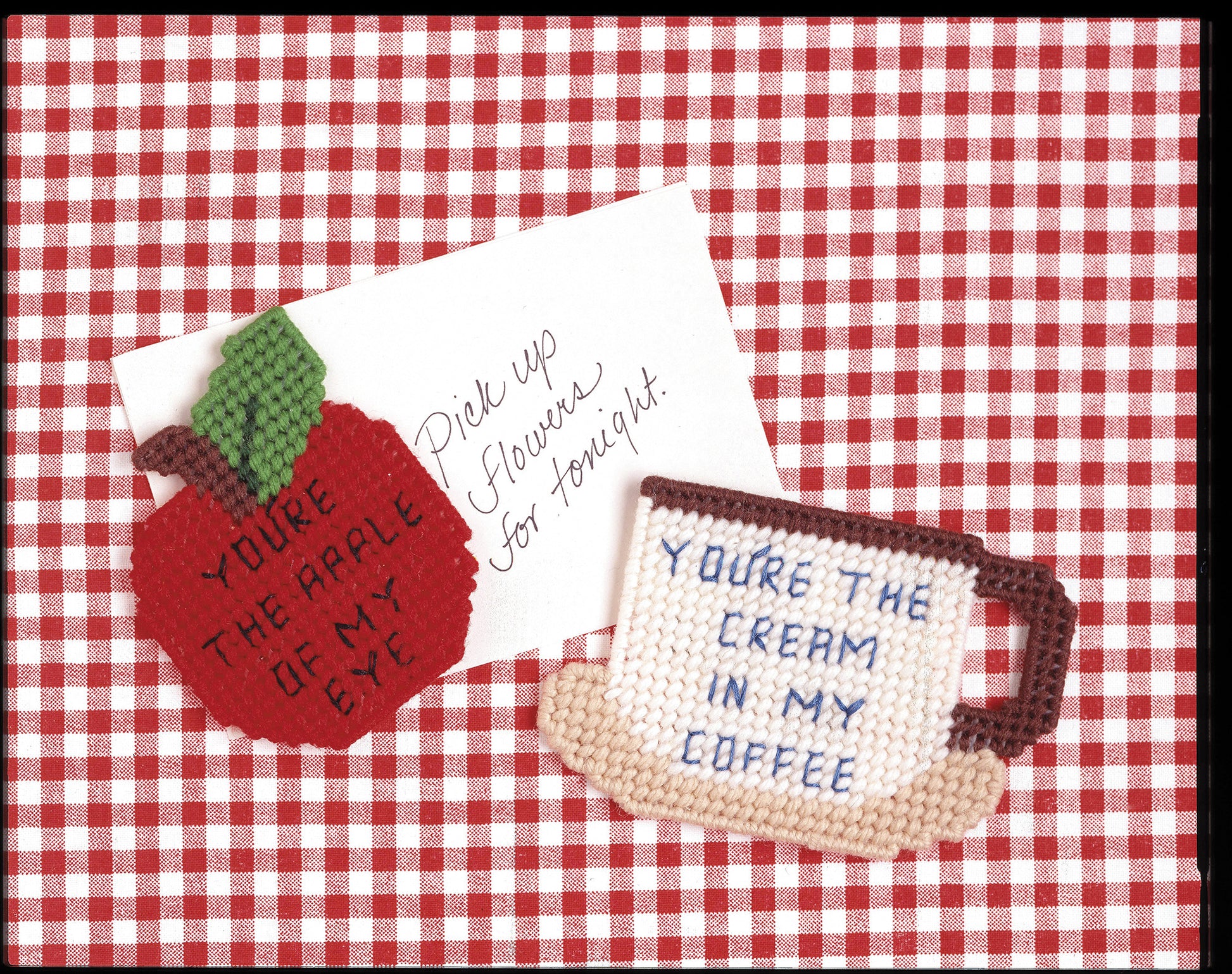 Create charming needlepoint magnets with Gifts Galore in Plastic Canvas Digital Download by Leisure Arts—includes patterns for a red gingham apple ("You’re the apple of my eye") and coffee mug ("You’re the cream in my coffee") designs.