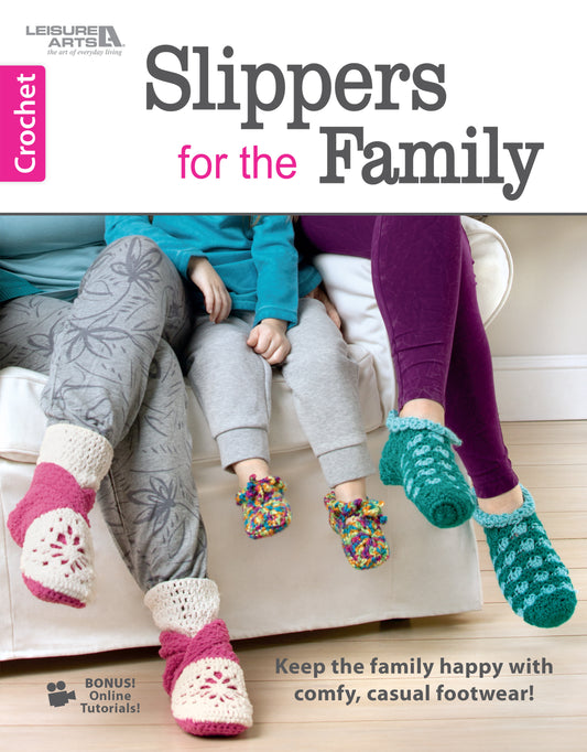 Three people sit on a couch, each wearing cozy crocheted slippers in different styles. The image showcases "Slipper for the Family Digital Download" by Leisure Arts, a perfect beginner-friendly crochet pattern for crafting stylish house shoes.