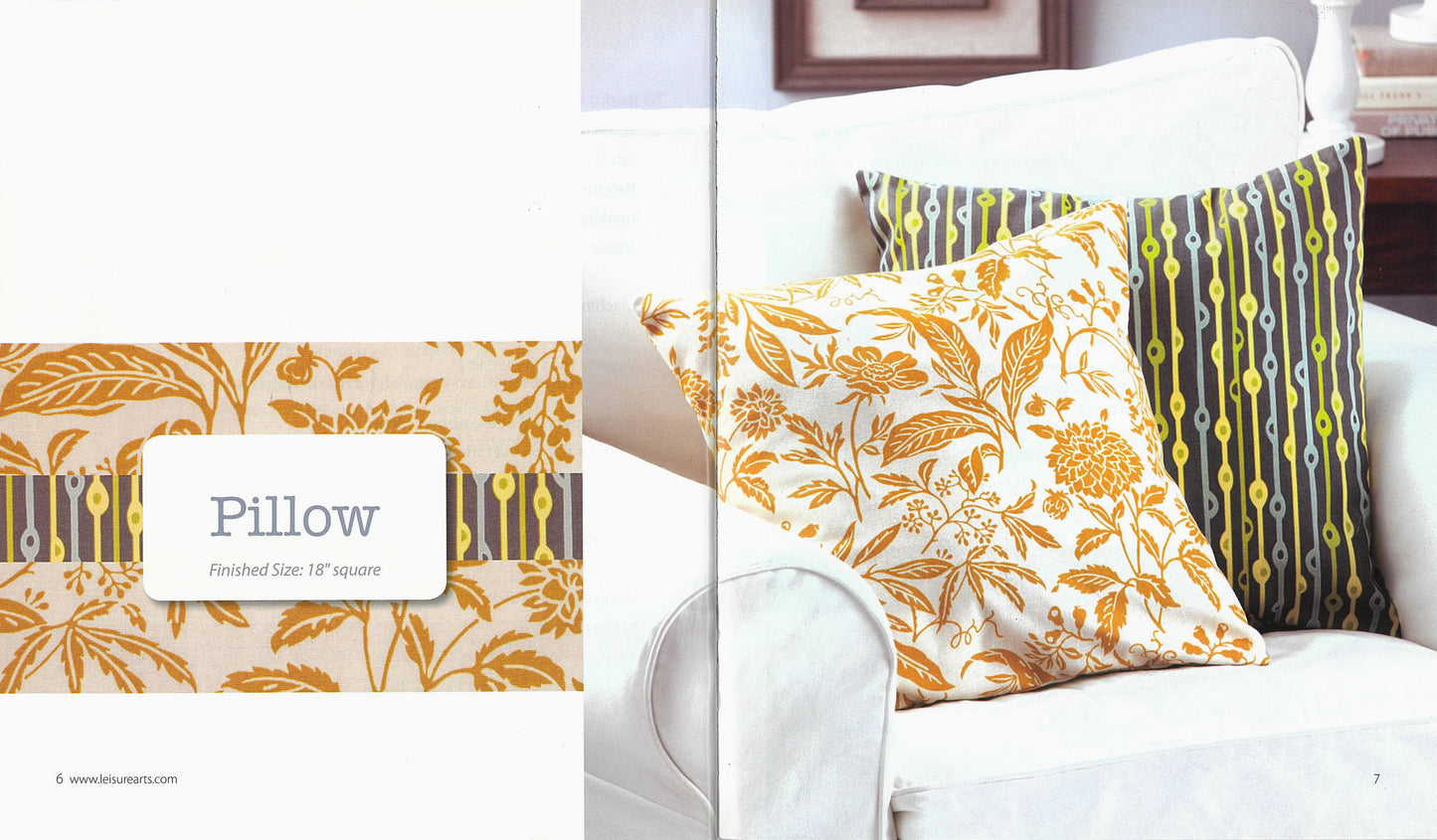 Two decorative pillows on a white sofa: one in a yellow floral pattern, the other with green, yellow, and gray stripes and dots—both perfect beginner projects featured in Leisure Arts' Simple Sewing.