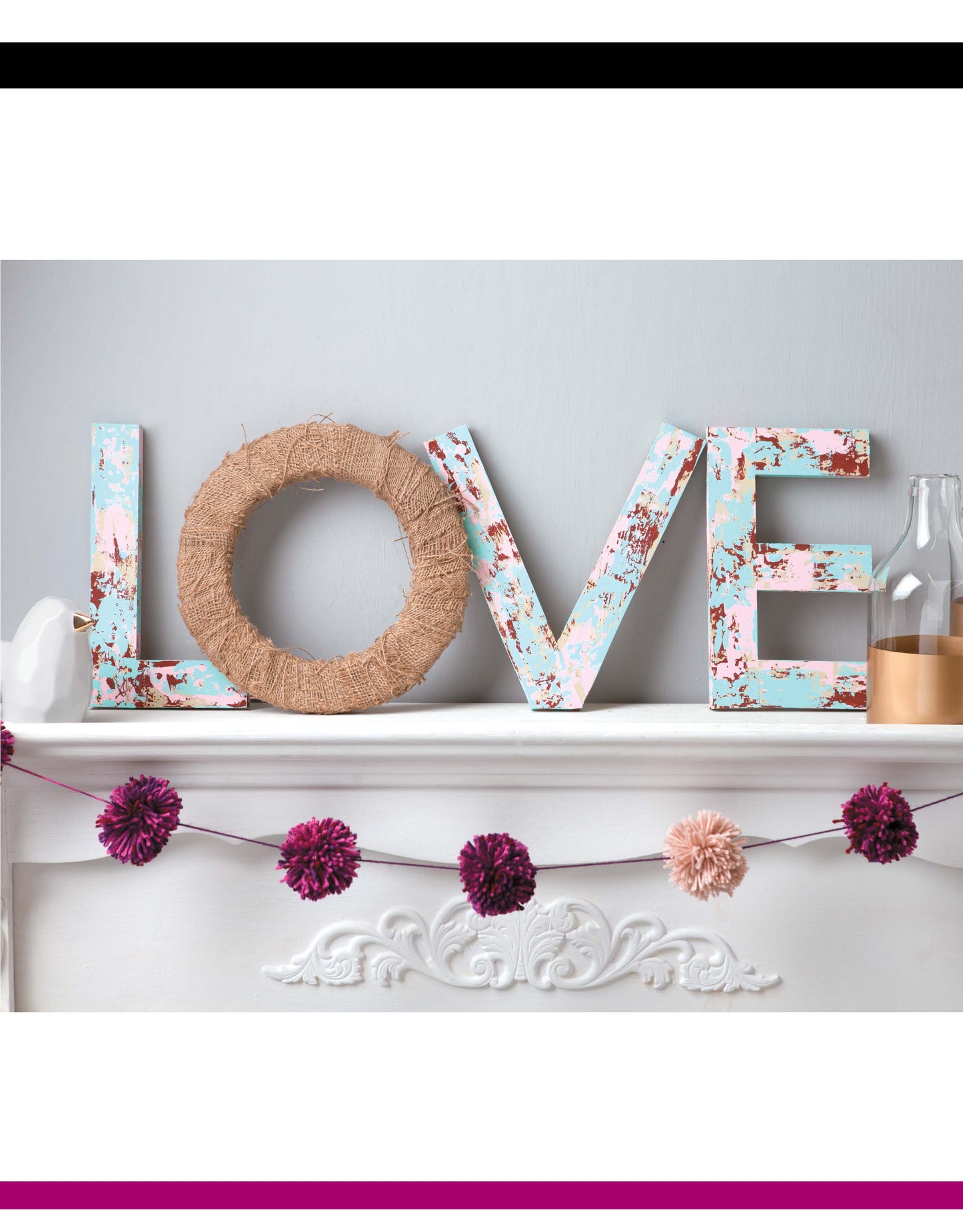 Decorating Letters Digital Download by Leisure Arts spells LOVE on a white mantel. The L, V, and E feature pastel florals; the O is wrapped in twine. Pink and purple pom-pom garland and bottles complete this charming home decor look.