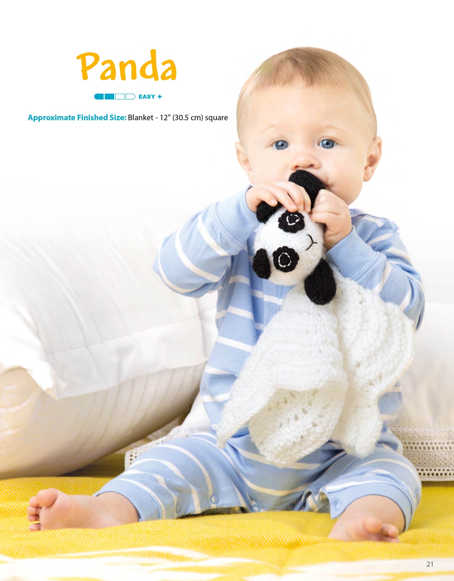 A baby in blue-striped pajamas sits on a yellow and white blanket, holding and chewing on a Leisure Arts Animal Lovies—Huggable Blanket Buddies toy, with a neutral couch behind. Bonus: online tutorials included!.