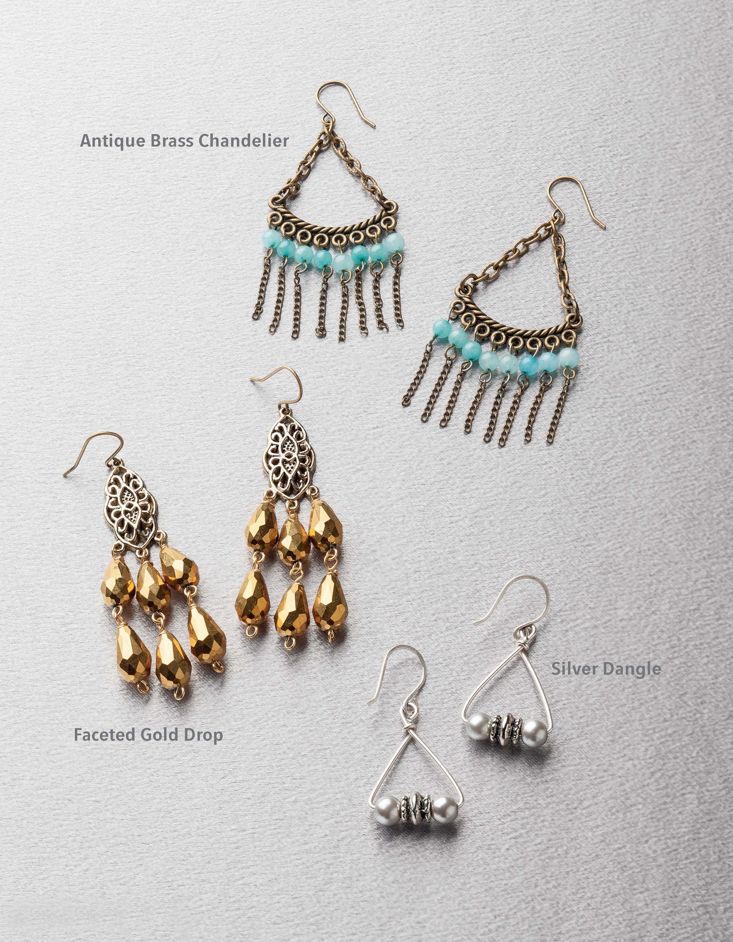 Jewelry for the Stars by Leisure Arts features three pairs of dangle earrings—antique brass with turquoise, gold drops with faceted beads, and simple silver—each style labeled beside the pair on a light gray background.