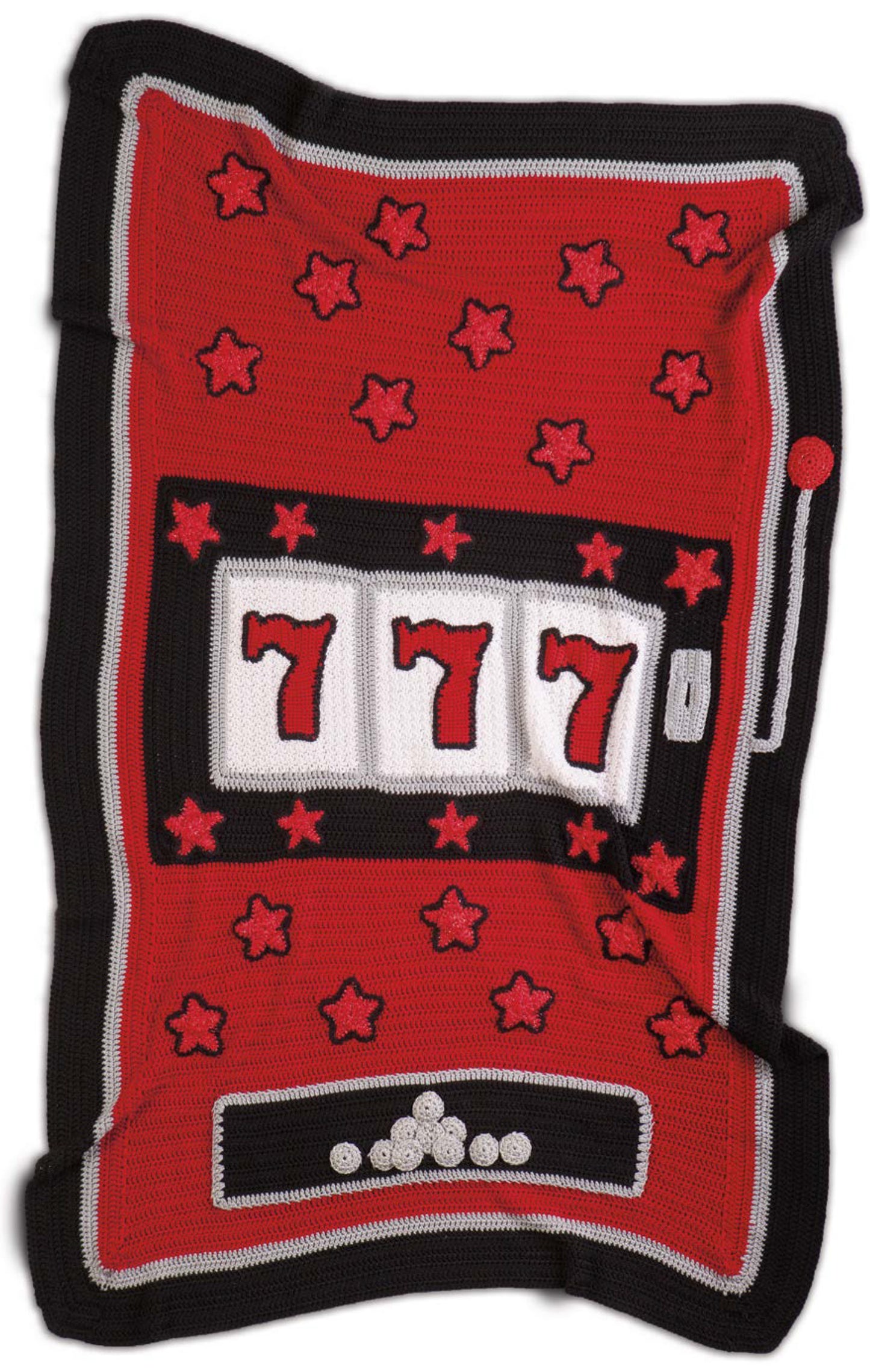 The Sportacular Afghans to Crochet Digital Download by Leisure Arts features a red, black, and white slot machine design with 777 reels, red stars, and a row of white buttons—perfect for man cave decor. Cloth appears slightly wrinkled.