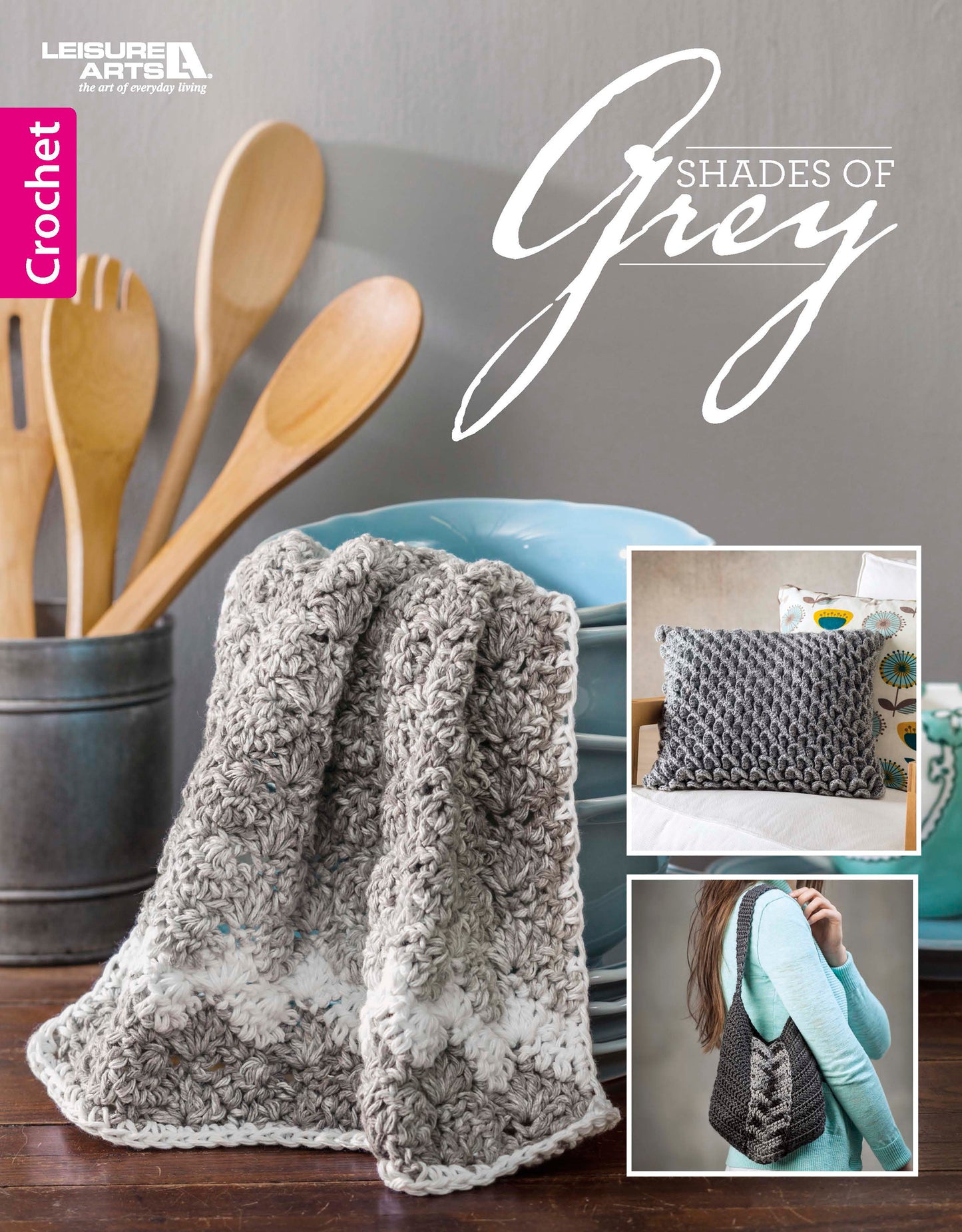 The Shades of Grey Crochet book by Leisure Arts features stylish grey and white blanket textures draped over a teal bowl, wooden spoons in the background, and smaller images of a pillow and bag—ideal for beginner crochet patterns.