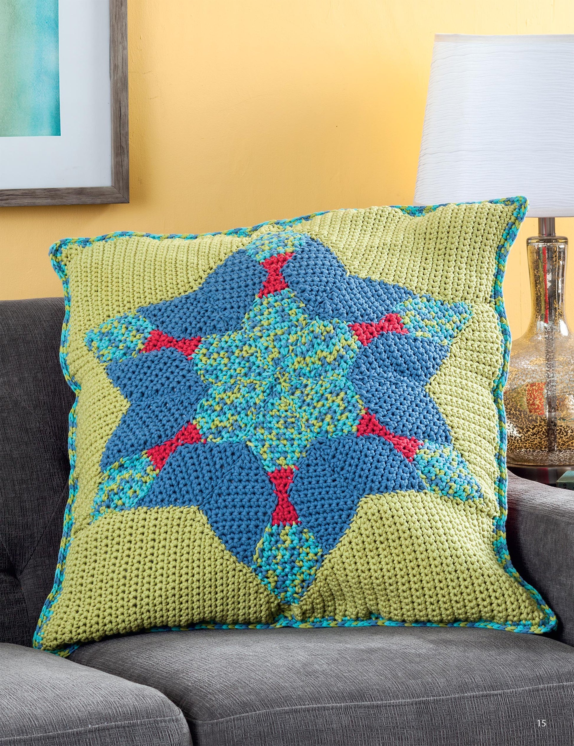 The Hooked On Quilted Crochet Digital Download by Leisure Arts features a geometric star pillow in blue, green, and red—an eye-catching accent for your home decor patterns collection.