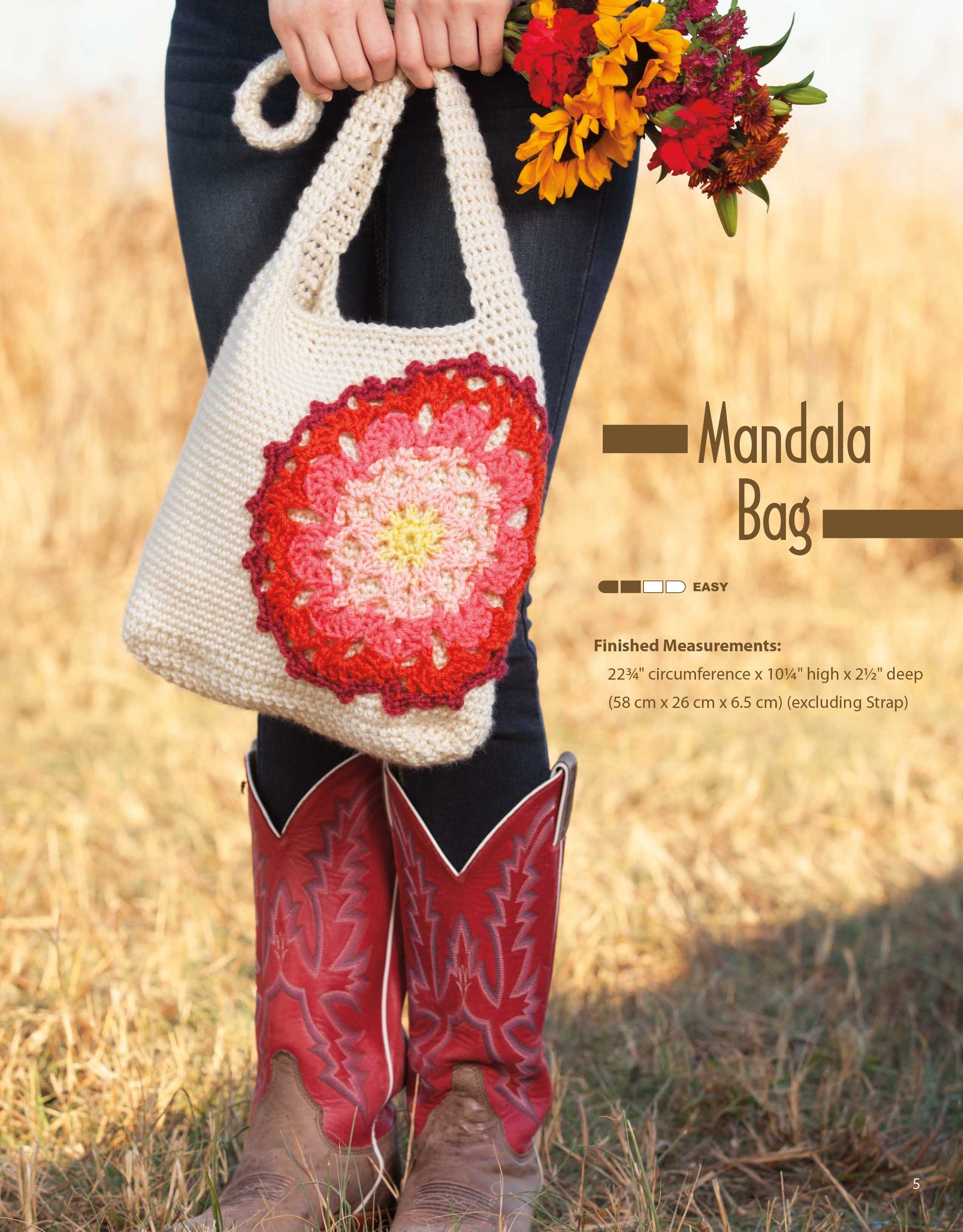 A person in red cowboy boots and jeans stands in a field, holding a cream crochet bag featuring a red-orange mandala. Perfect for trendy bags! Text: Crochet Rucksacks & Backpacks Digital Download by Leisure Arts with finished measurements.