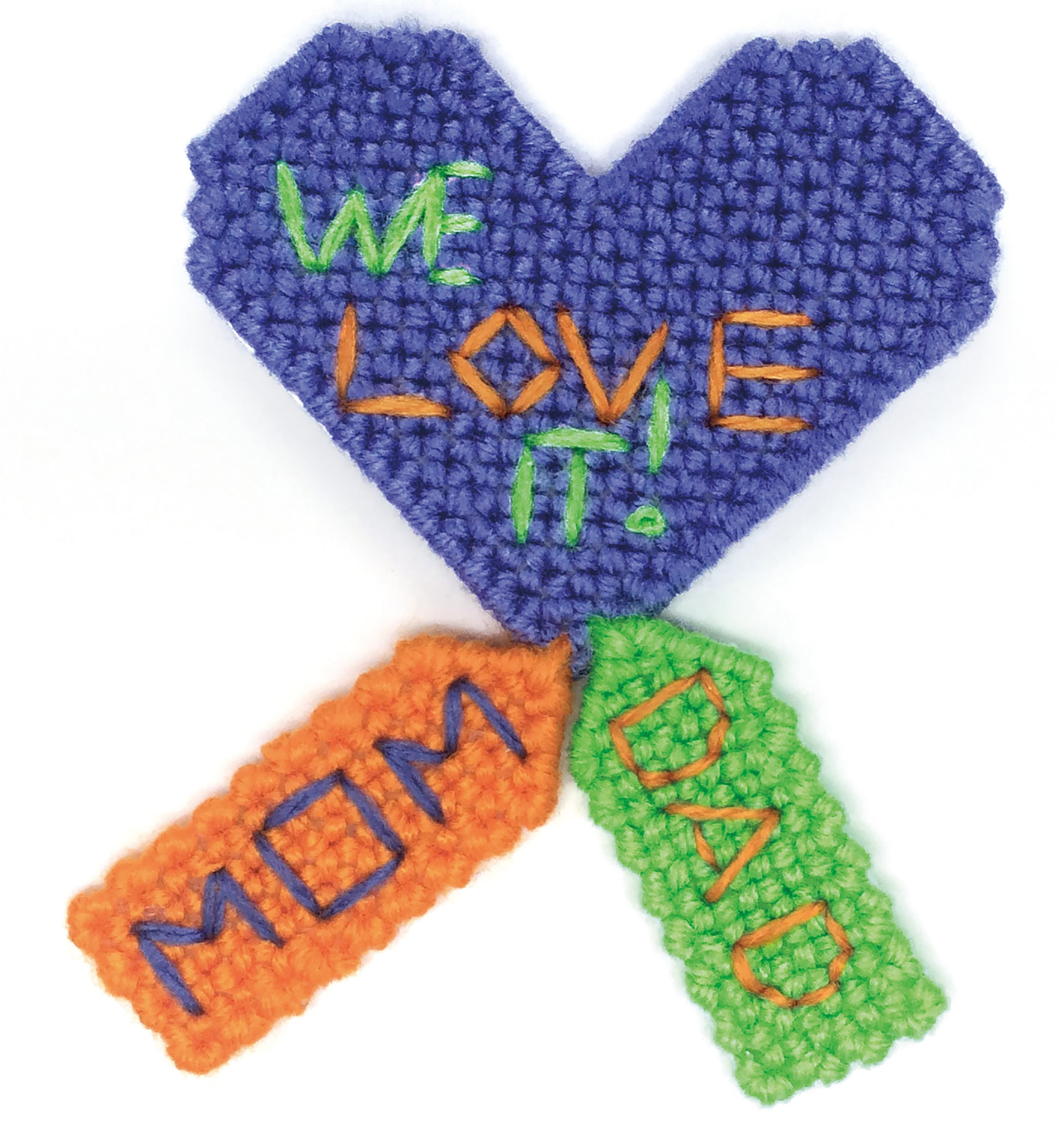 The Leisure Arts Show Off Magnets in Plastic Canvas features a purple, heart-shaped design with "We Love It!" in green and orange, plus "MOM" (orange) and "DAD" (green) tags—great for family photos or invitations.