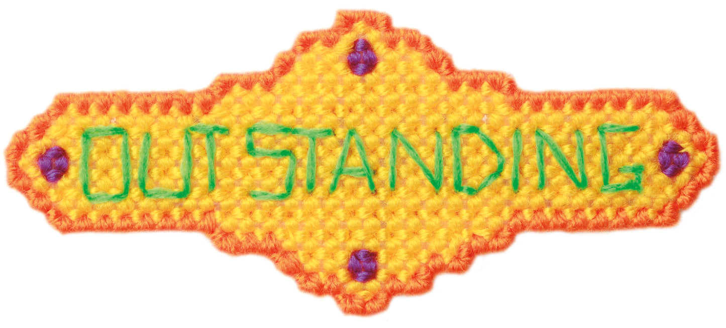 A yellow, hand-stitched "Show Off Magnets in Plastic Canvas" badge by Leisure Arts features an orange border, purple corner dots, and OUTSTANDING in green—great for blue ribbon kids or to highlight event invitations.
