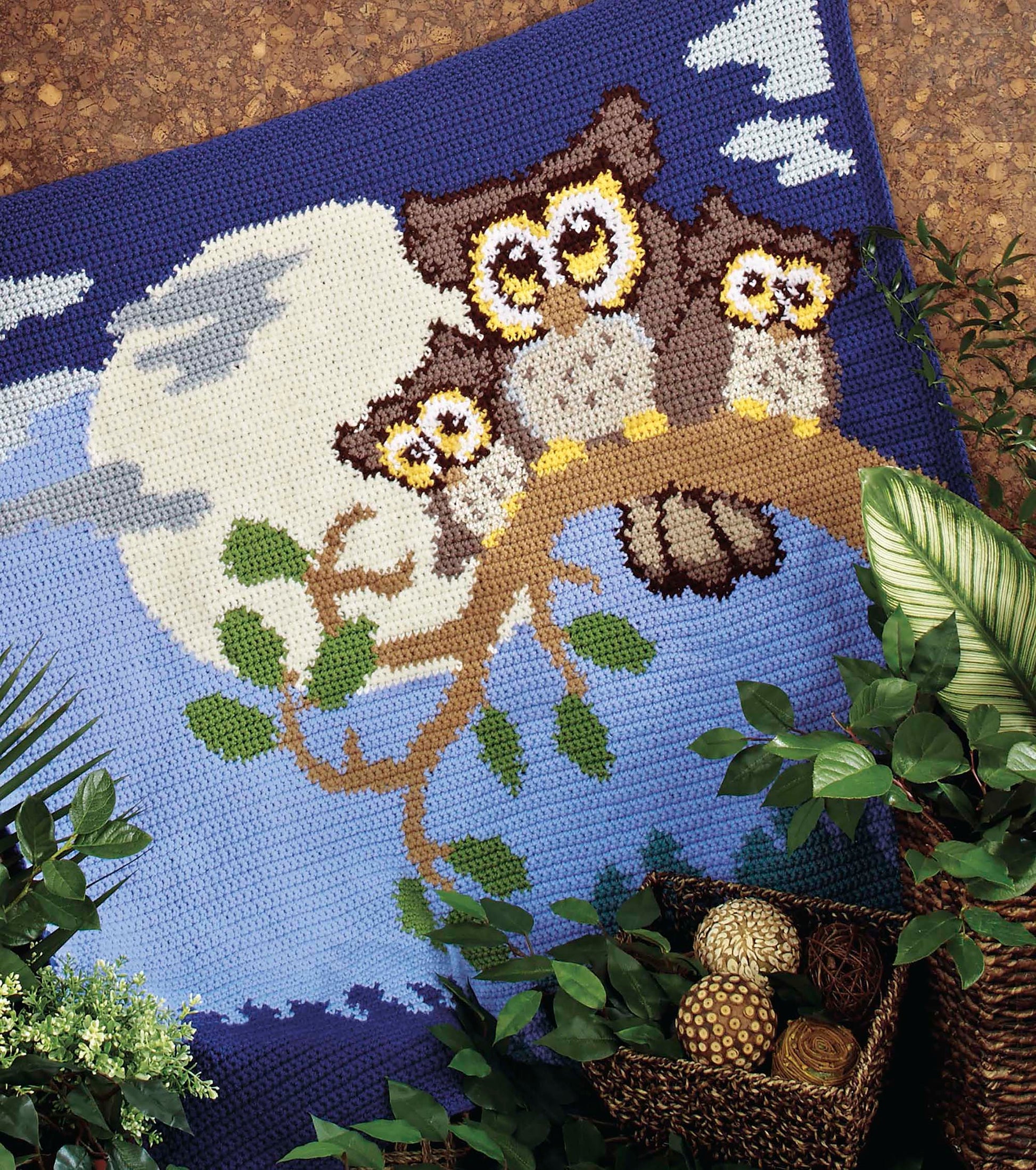 The Crochet Bedtime Blankies by Leisure Arts features adorable owl designs with a moonlit sky and tree branches—ideal inspiration for your next cozy crochet project or bedtime blanket.
