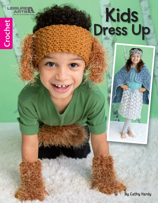 A child wears a crocheted dog costume with brown ears, headband, and paw covers. Inset: another child in a blue cape. Text says “Crochet Kids Dress Up Digital Download” by Leisure Arts—perfect for dress up fun!.