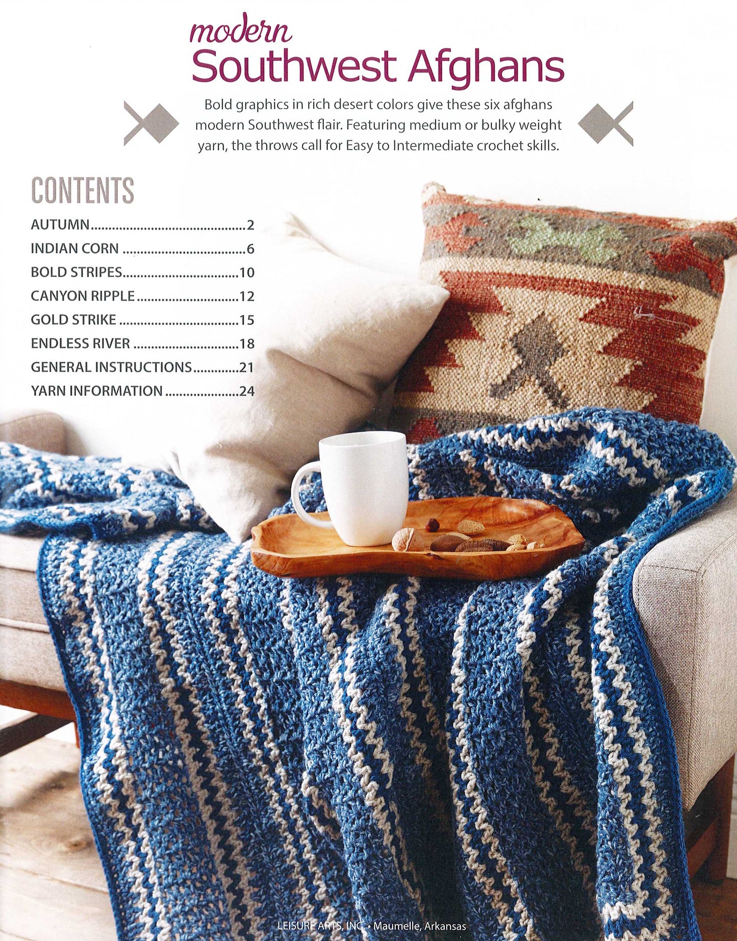A cozy setting features blue and white striped crochet throws, a wooden tray with a white mug, and a Southwestern-patterned pillow. Overlaid on the image is the table of contents for "Modern Southwest Afghans" by Leisure Arts.
