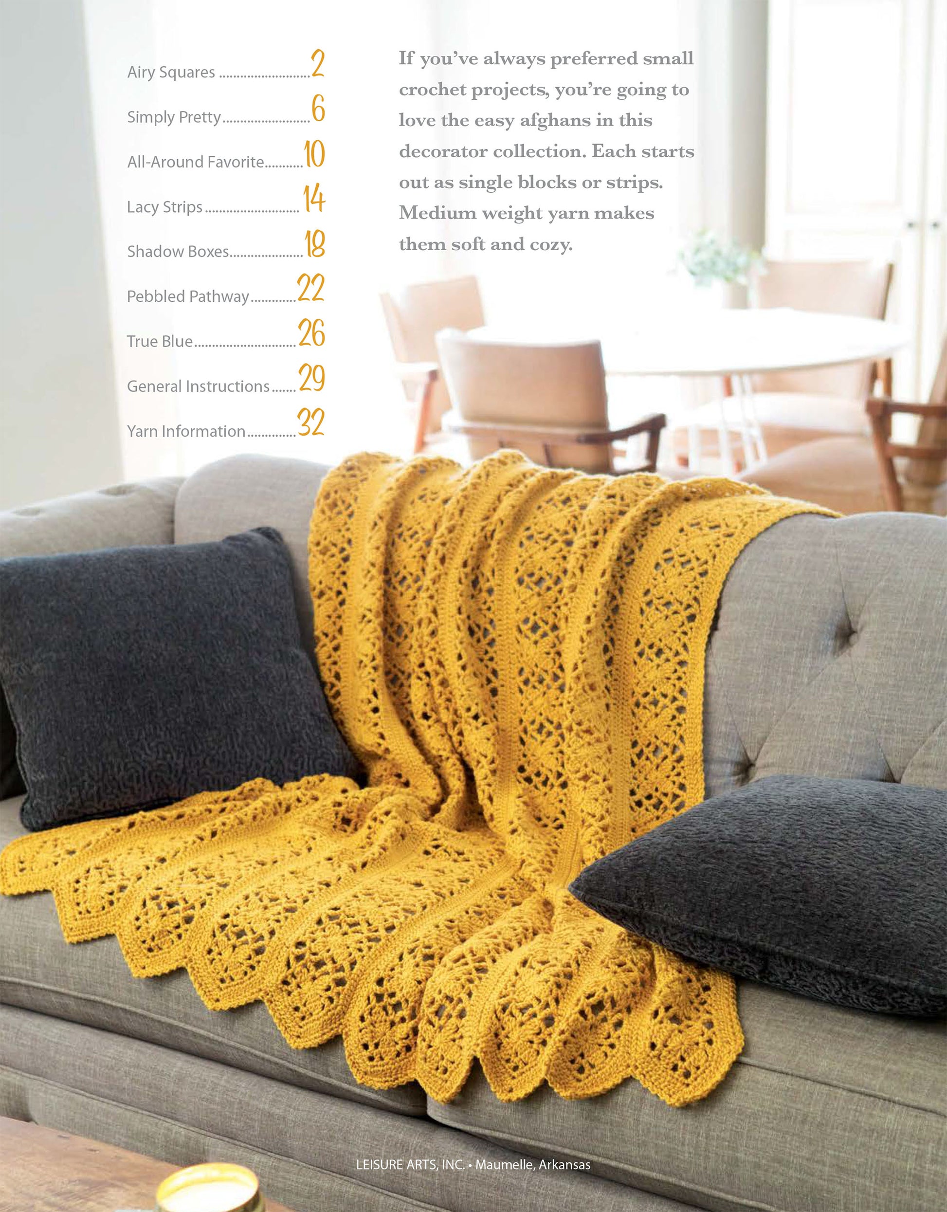 Brighten your living room with a gray couch draped in a yellow afghan made from easy granny squares, inspired by Leisure Arts' "Blocks and Stripes—7 Cozy Projects Using Easy Granny Squares & Strips." Ideal for beginner crochet enthusiasts!.