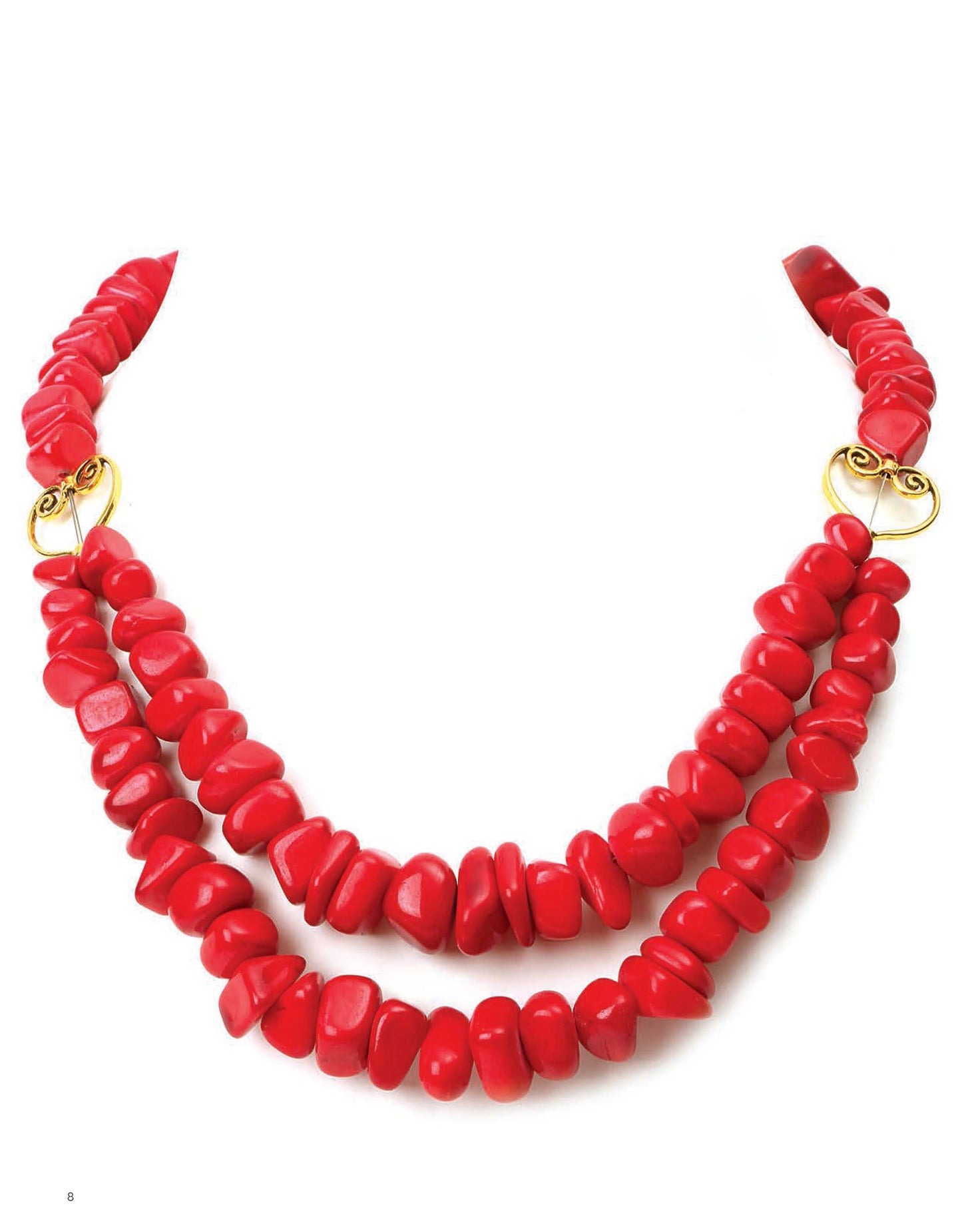 The "Quick & Simple Jewelry Beading for Beginners" kit by Leisure Arts features a double-strand necklace with chunky, irregular red beads and gold spiral accents, shown against a white background.