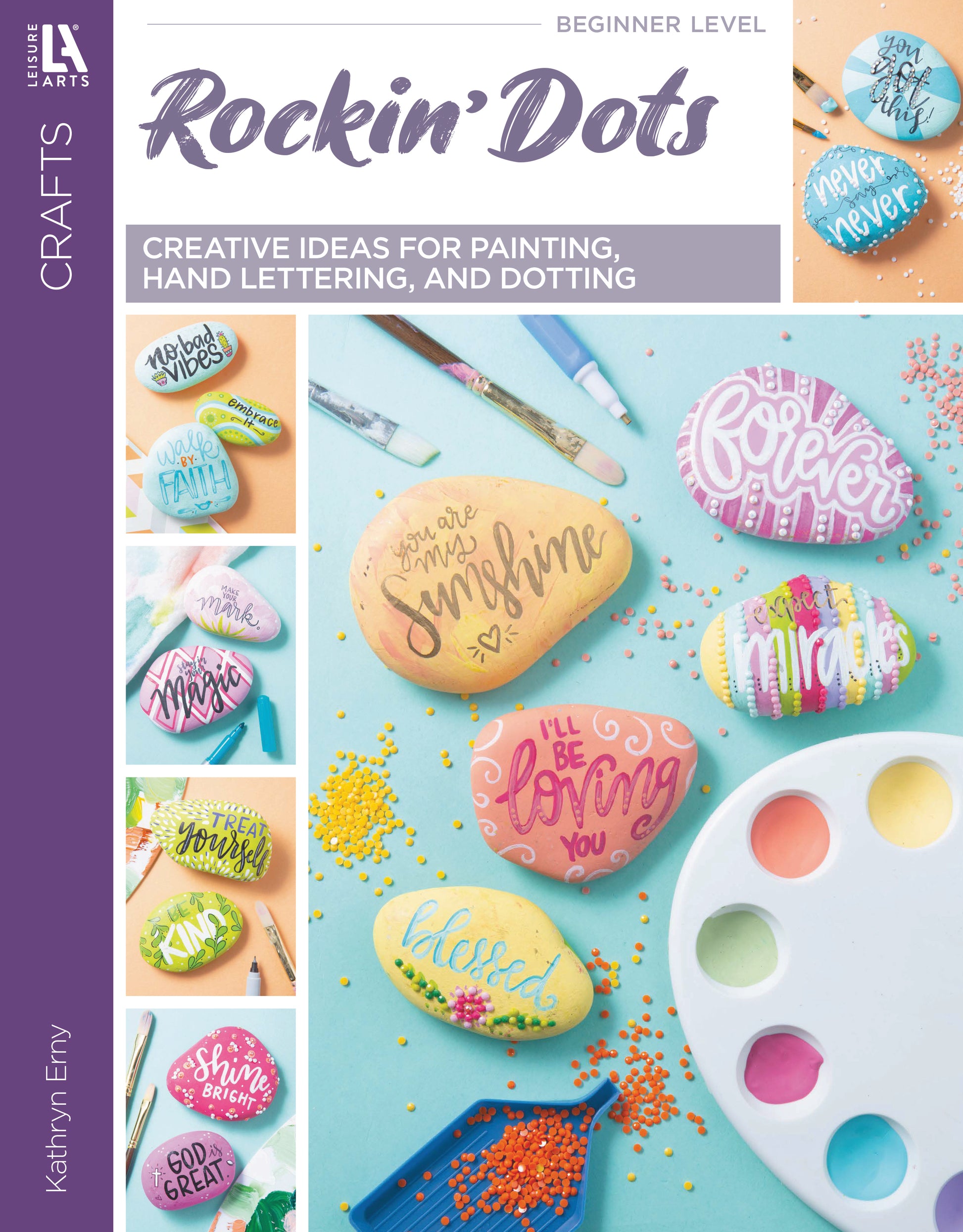 The Rockin' Dots—Creative Ideas for Painting, Hand Lettering, and Dotting Digital Download by Leisure Arts features colorful painted rocks with positive messages, a paint palette, and brushes—ideal for rock painting enthusiasts.