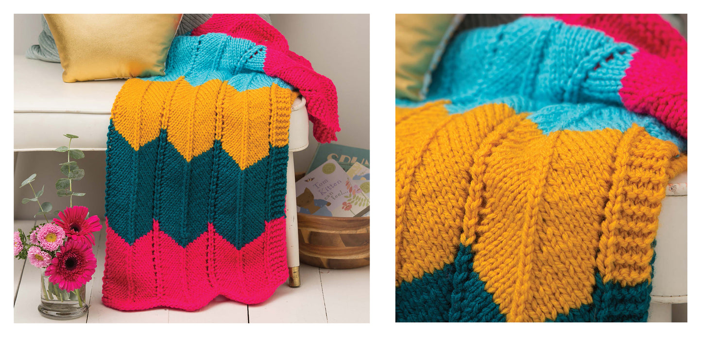 The Leisure Arts "Make Your First Knit Baby Afghan" features bold zigzag stripes in turquoise, yellow, dark green, and bright pink. Perfect for beginners, its textured stitches and vibrant colors make it a standout addition to any space.