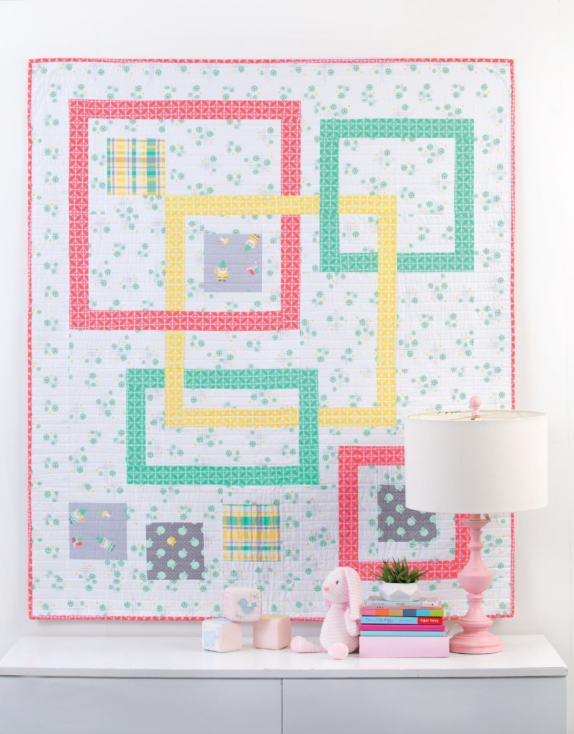 The "Baby Quilts—7 Modern Designs to Make Great Gifts Plus Bonus Online Projects" by Leisure Arts features colorful, handmade quilts, perfect for brightening up any nursery décor.