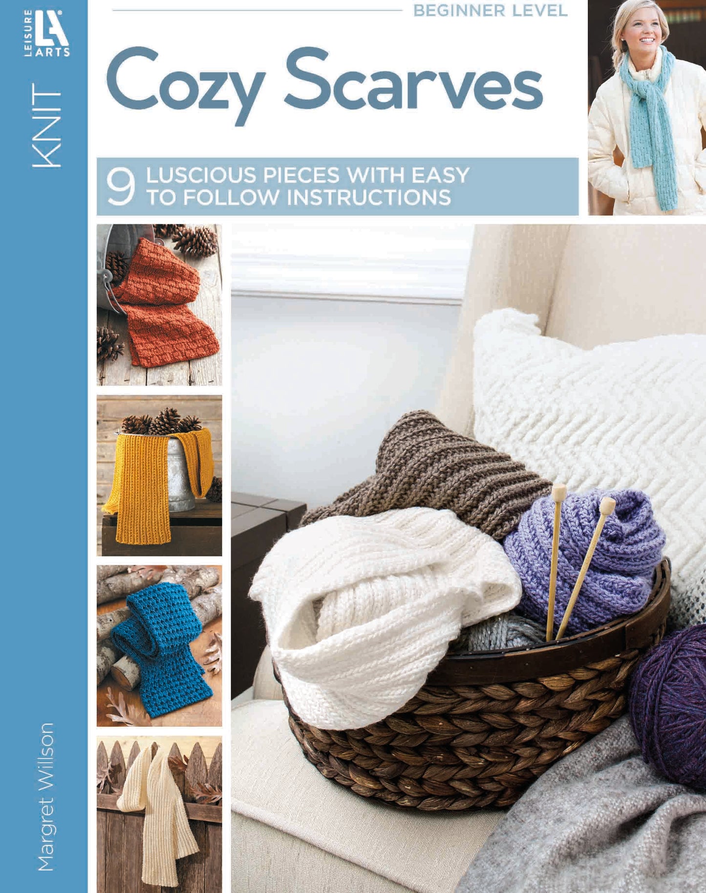 Leisure Arts Cozy Scarves Knitting book features beginner-friendly scarf patterns in various colors and textures, with yarn and needles pictured in a basket on a beige chair. Includes easy knitting instructions for all levels.