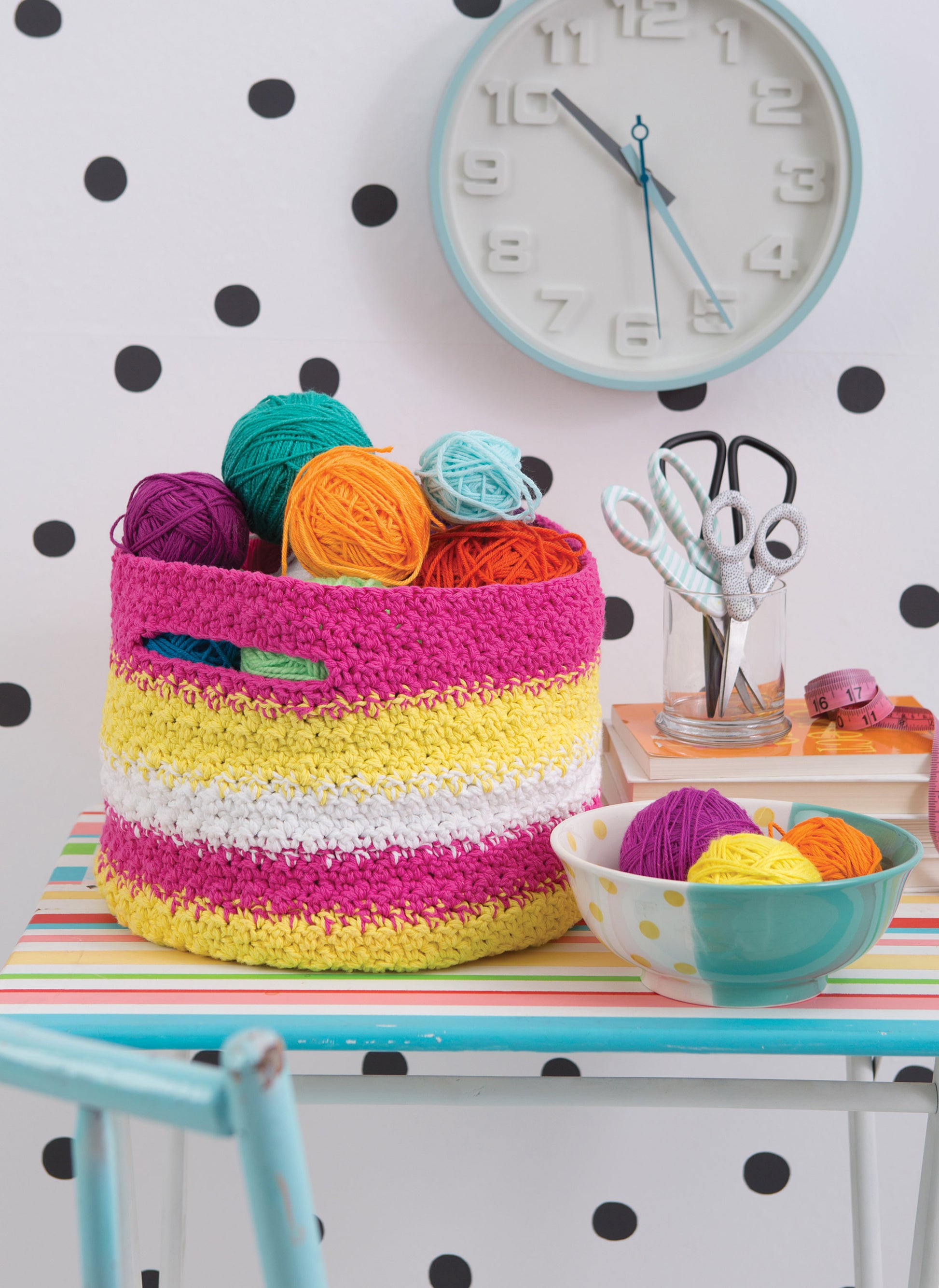 Brighten your day with Happy Crochet—13 Fun Projects That Are Sure to Brighten Your Day by Leisure Arts, featuring inspiring images of crocheted baskets, yarn balls, and crafting supplies—all set against a cheerful background.
