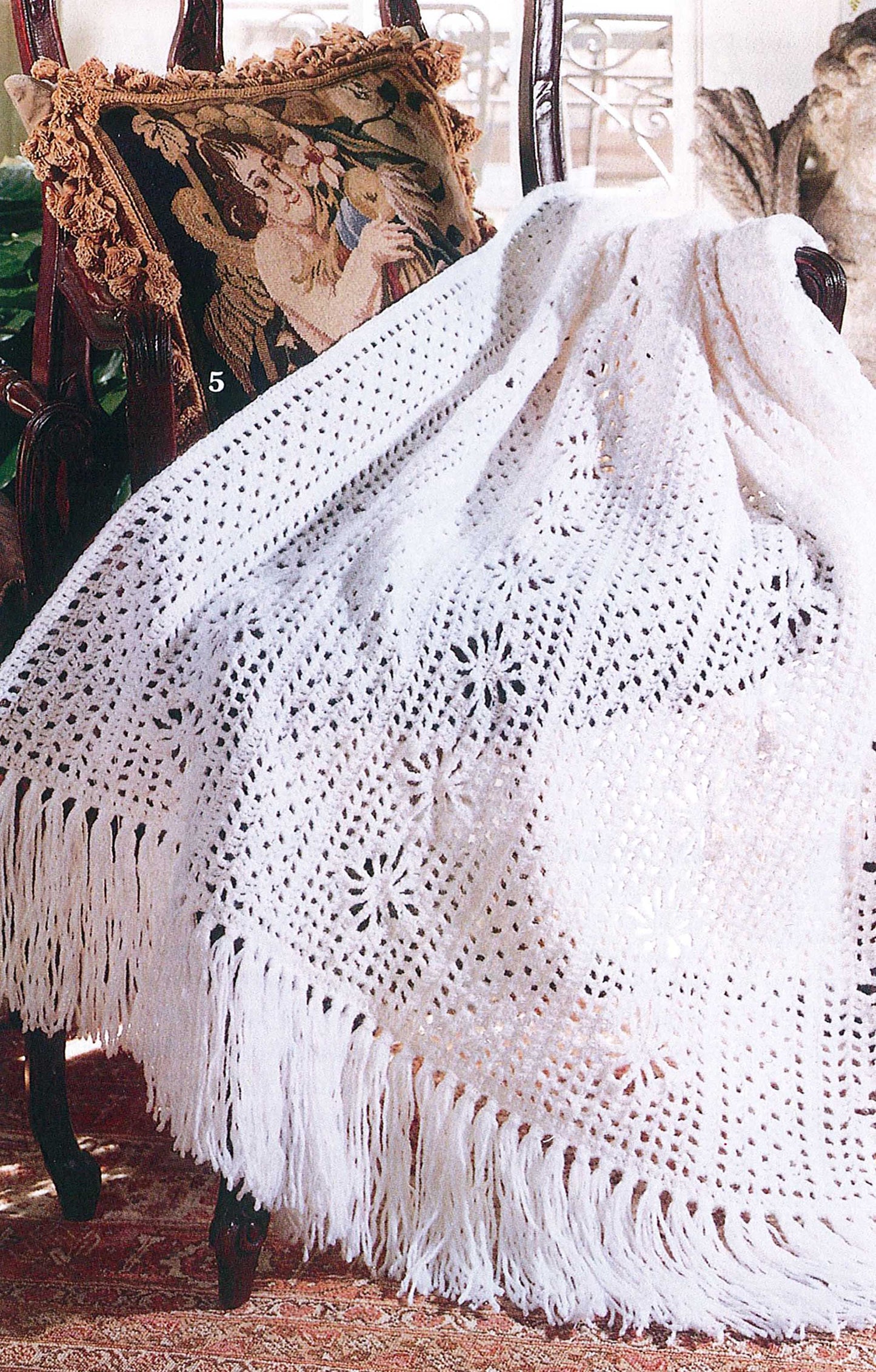 19 Crochet Stitches & Easy Projects Digital Download by Leisure Arts offers beginner-friendly patterns to create beautiful items like a white floral crocheted blanket, perfect for adding charm to your home decor.